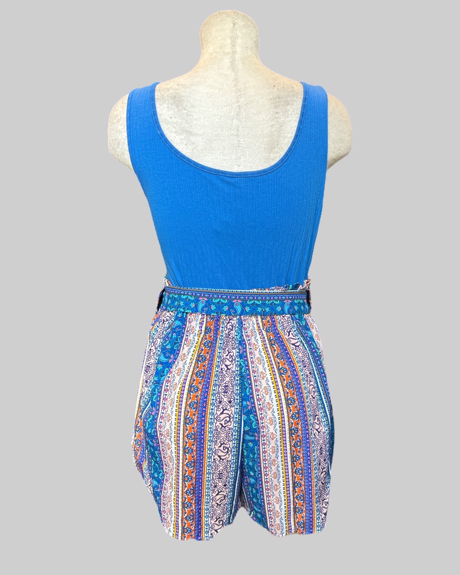 1x blue romper with multi pattern bottoms and tie belt
