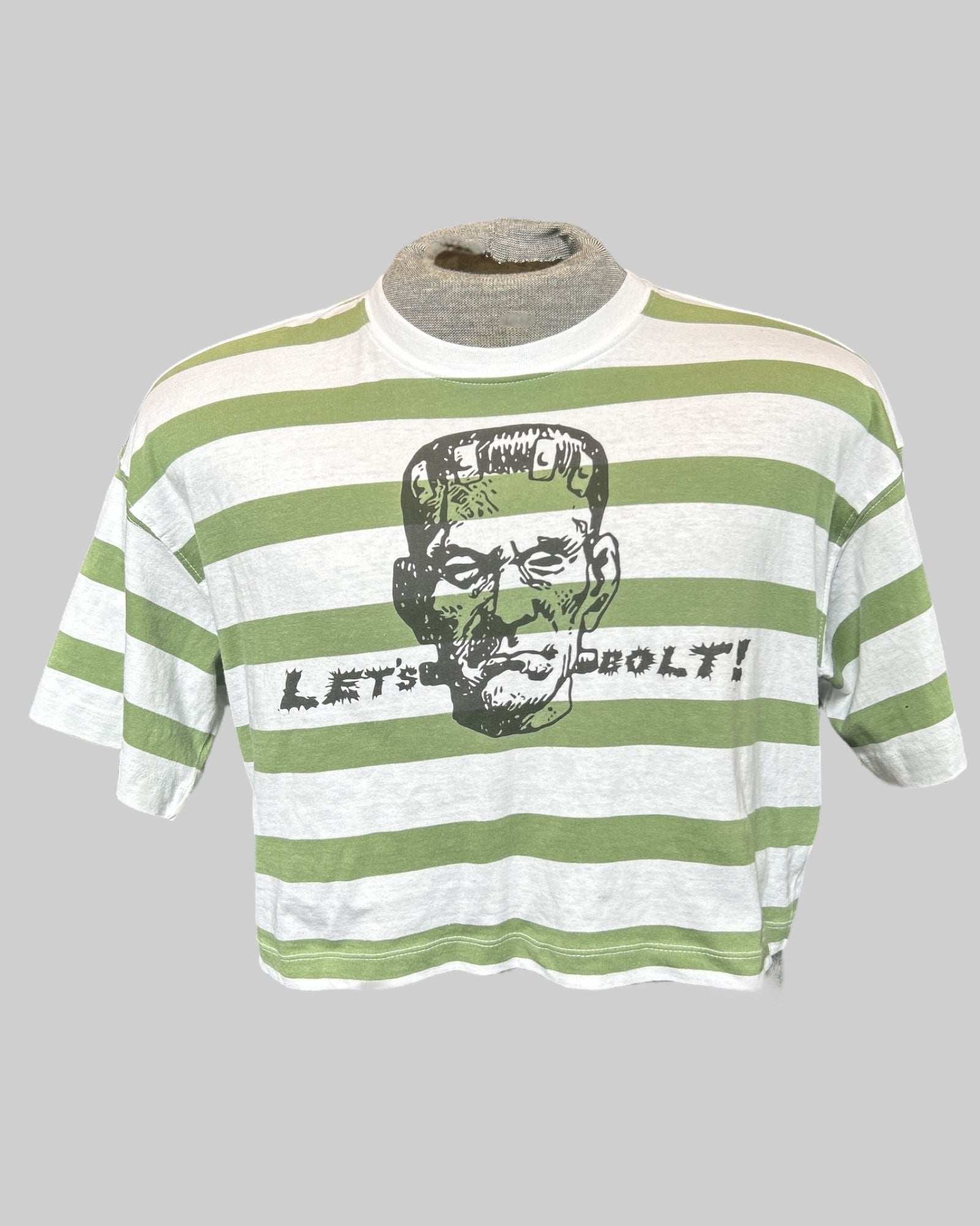 L green and white striped cropped top with “let’s bolt” frankenstein graphic