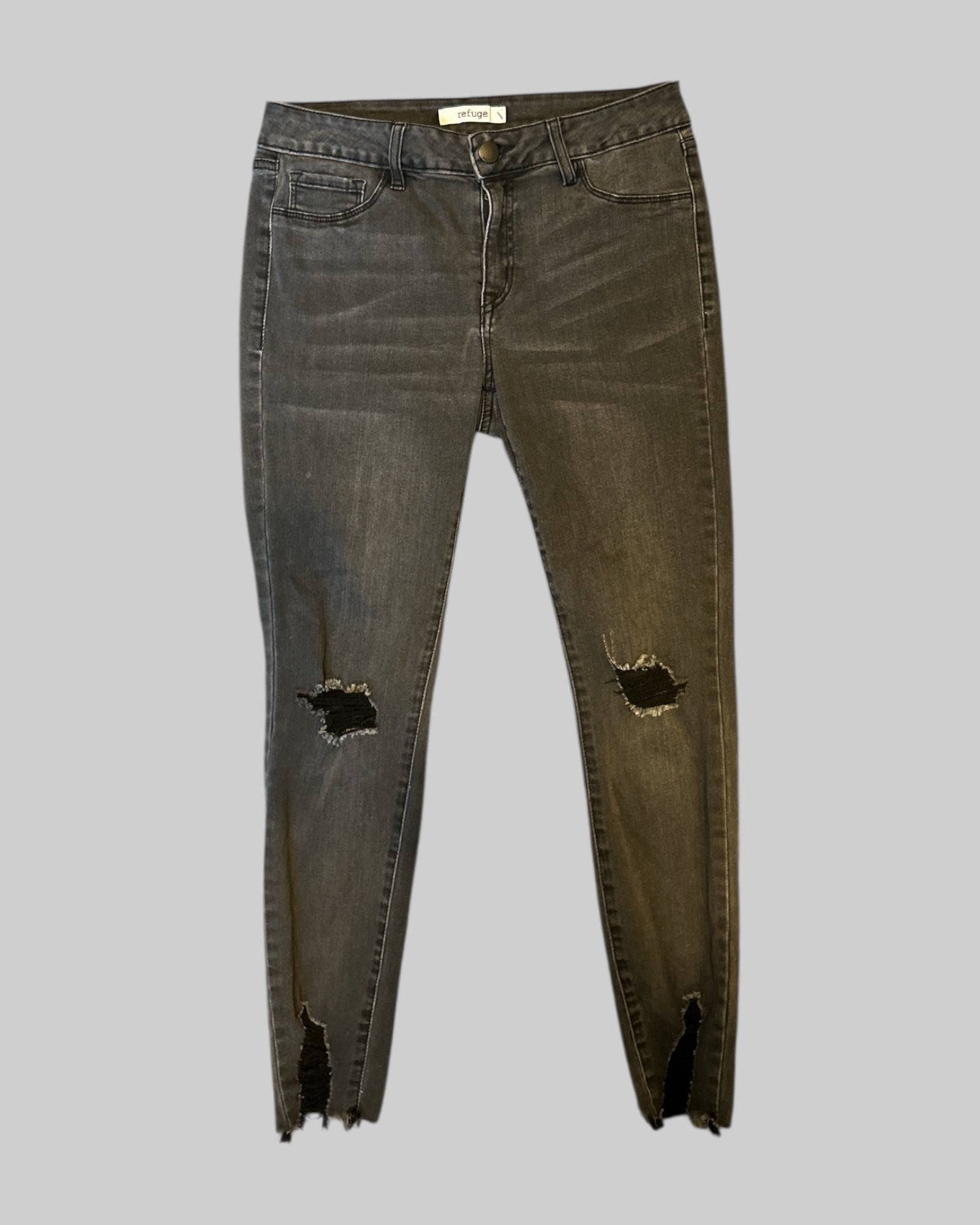 M black stretchy jeans with pockets and distressed knees