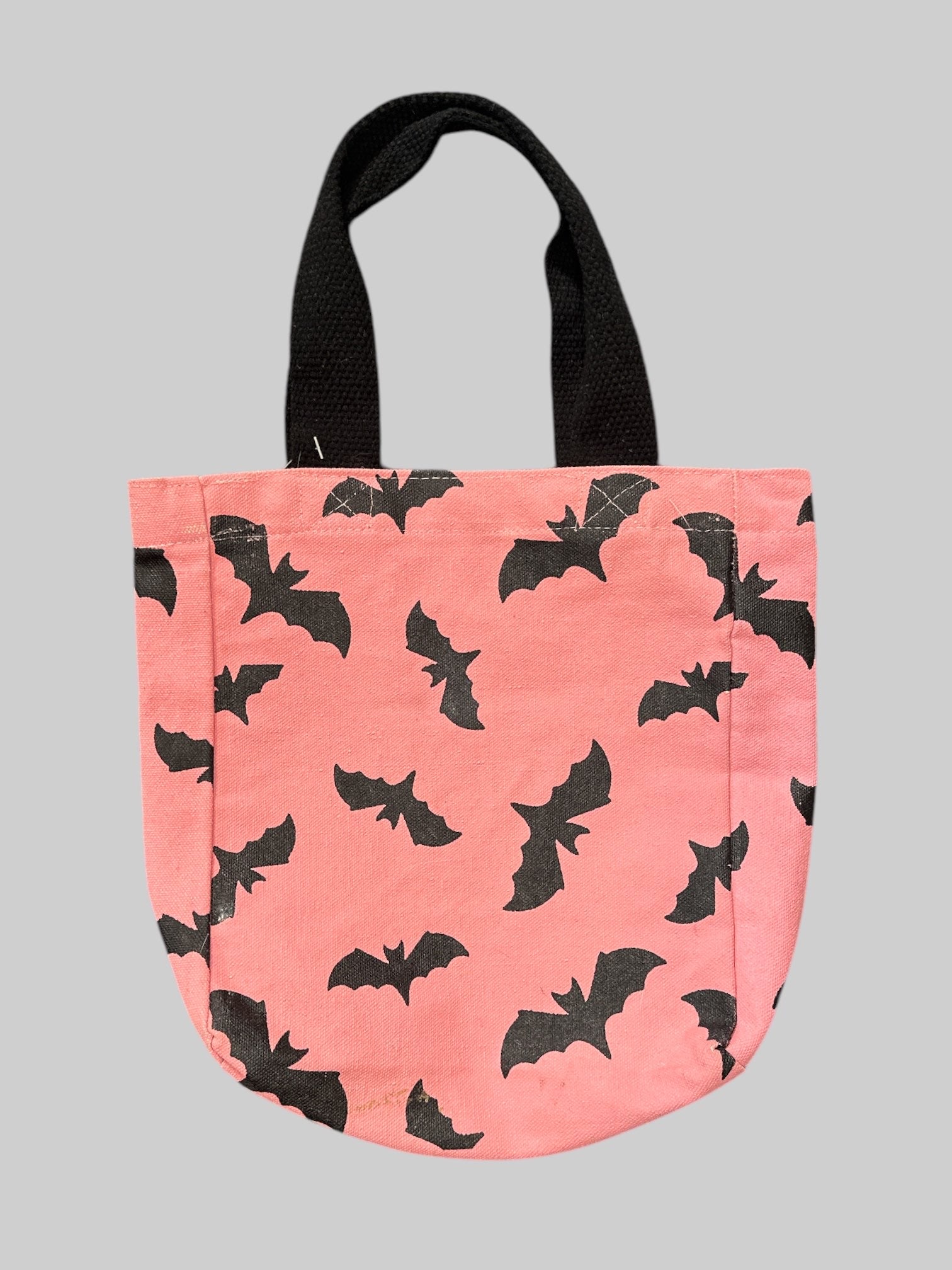 Pink and black tote bag with bats design