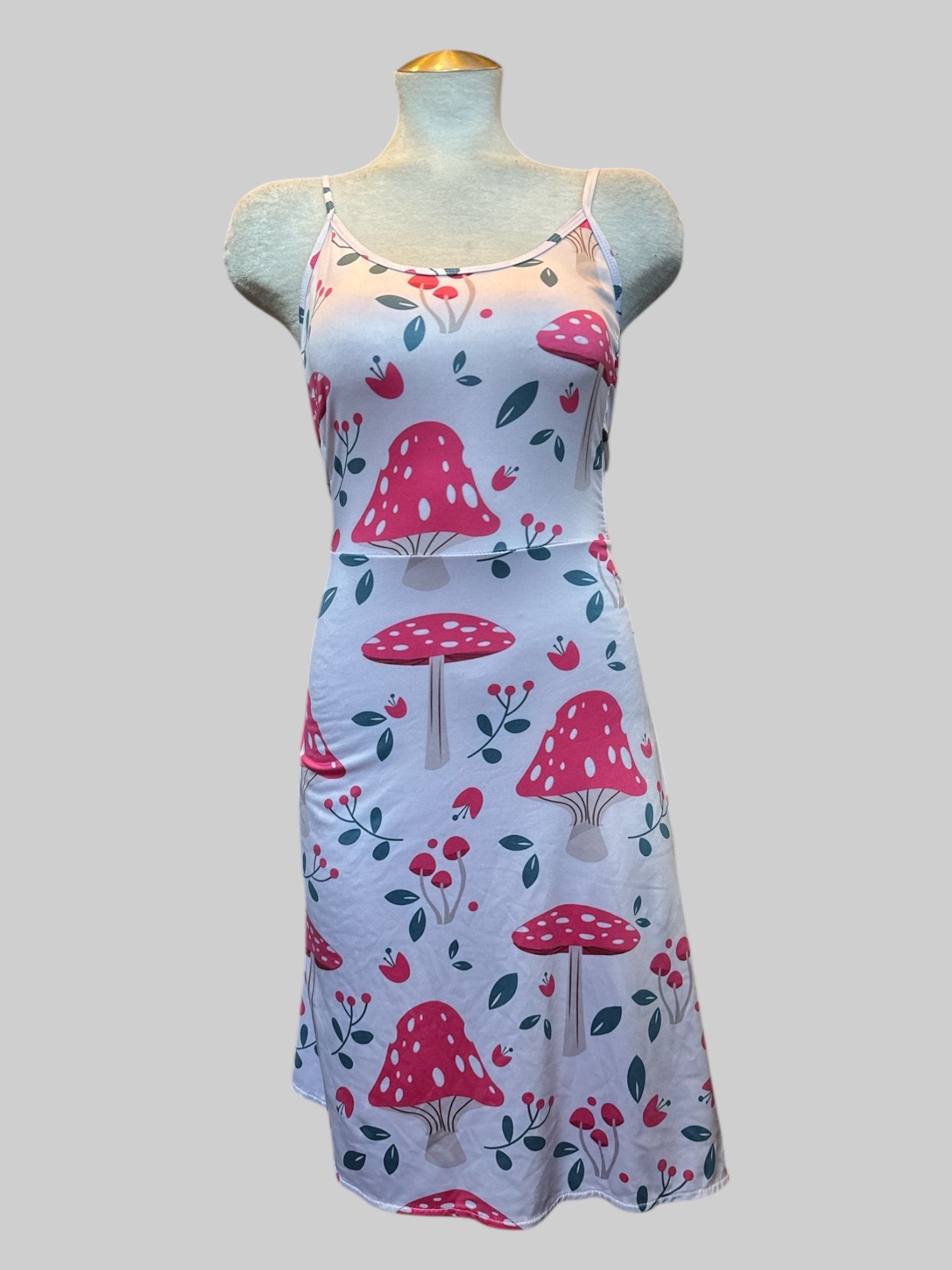 1X fit and flare white dress with mushroom graphics has lots of stretch and back zipper