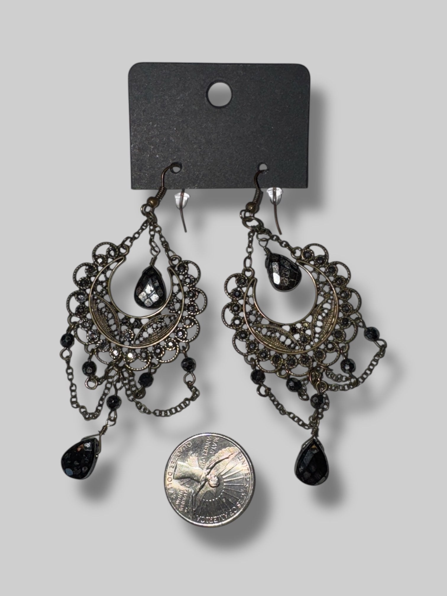 Black gem ornate dangly earrings