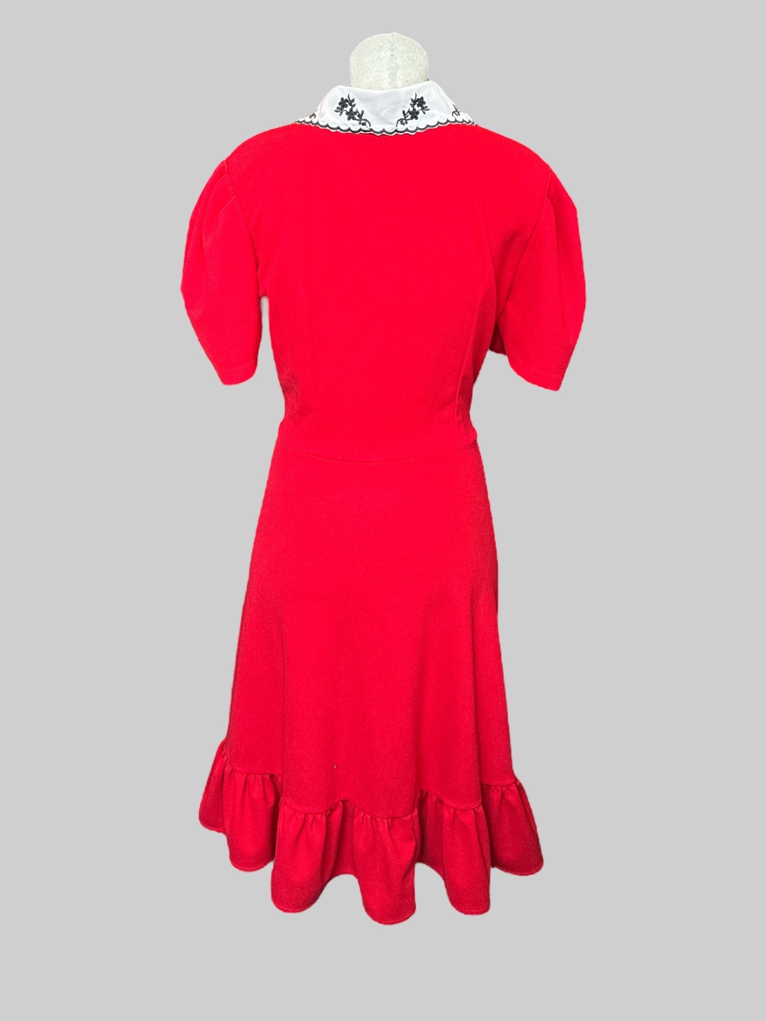 L Red stretchy and flowy dress with black buttons, white collar with embroidery and ruffle hem