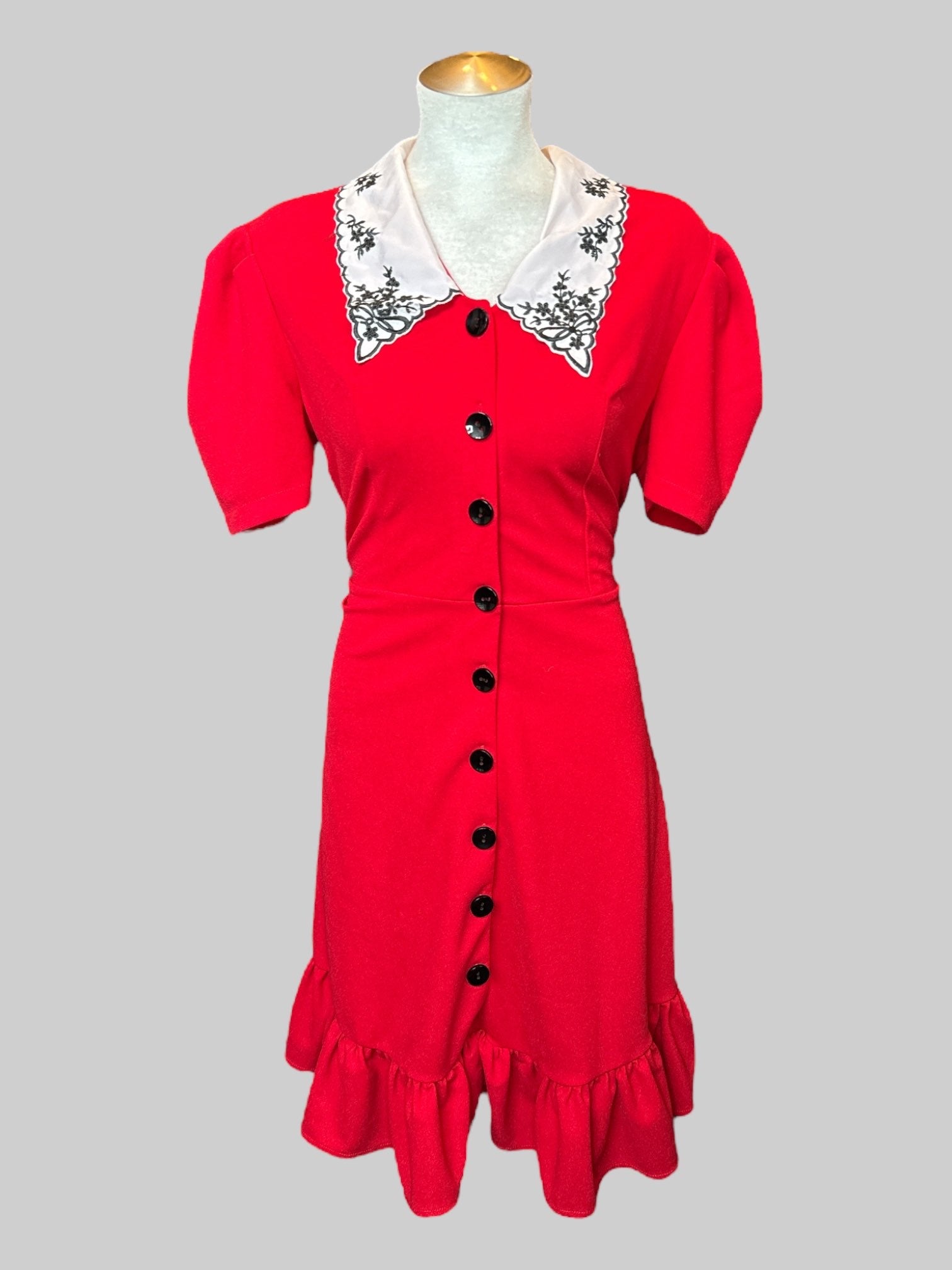 L Red stretchy and flowy dress with black buttons, white collar with embroidery and ruffle hem