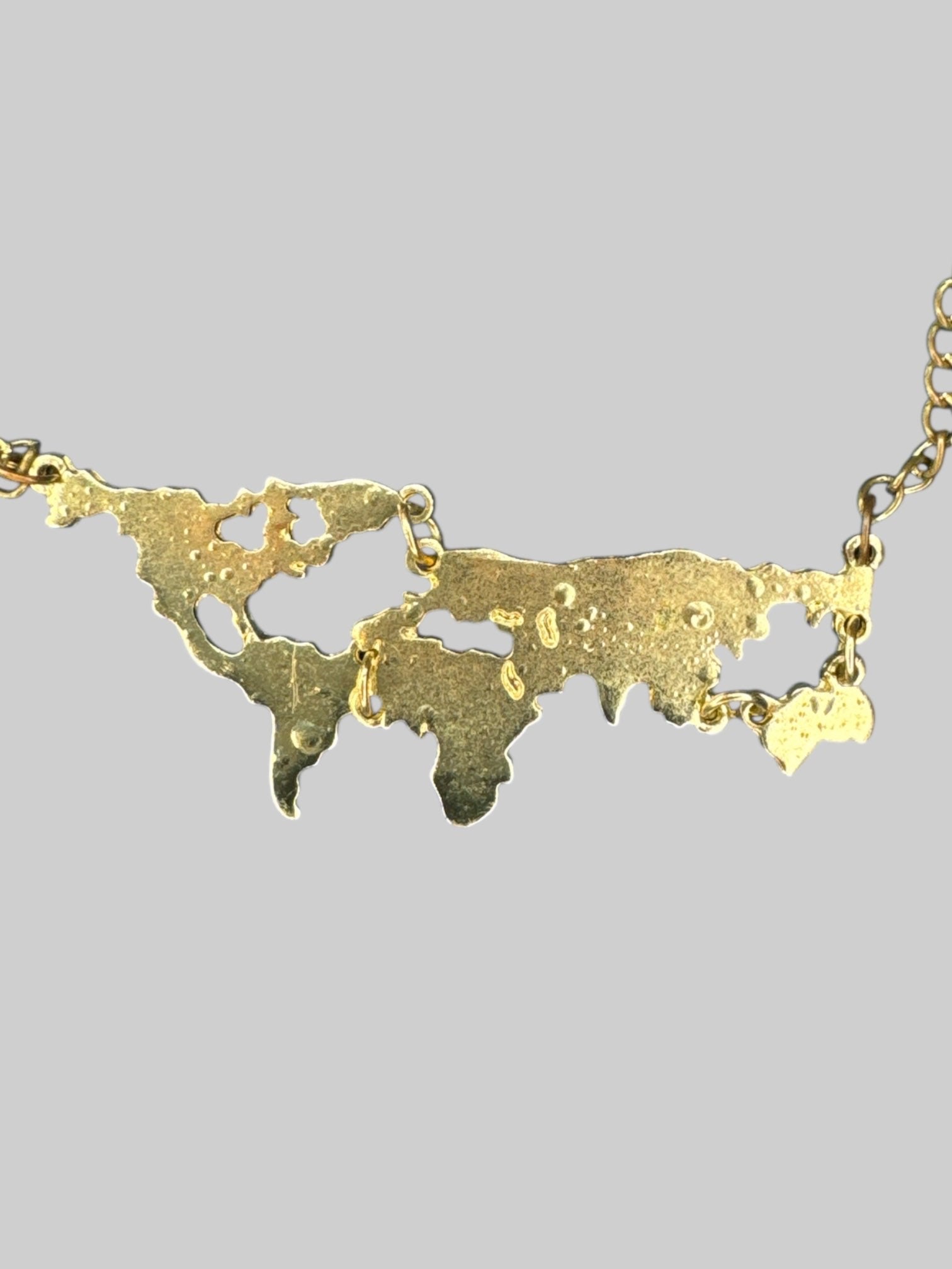 Gold color world map necklace