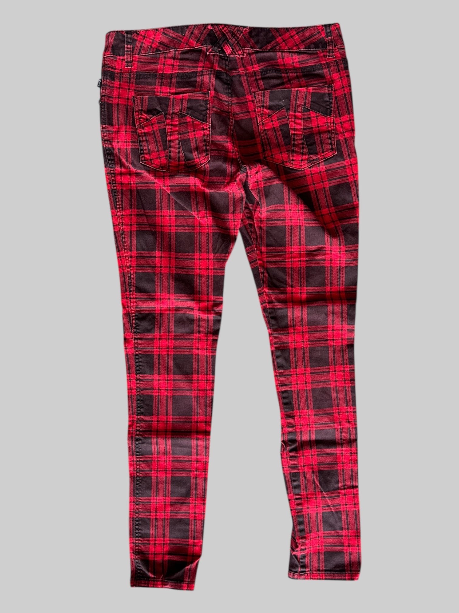 XL Tripp red and black stretchy plaid pants with back pockets and skull details on front pockets