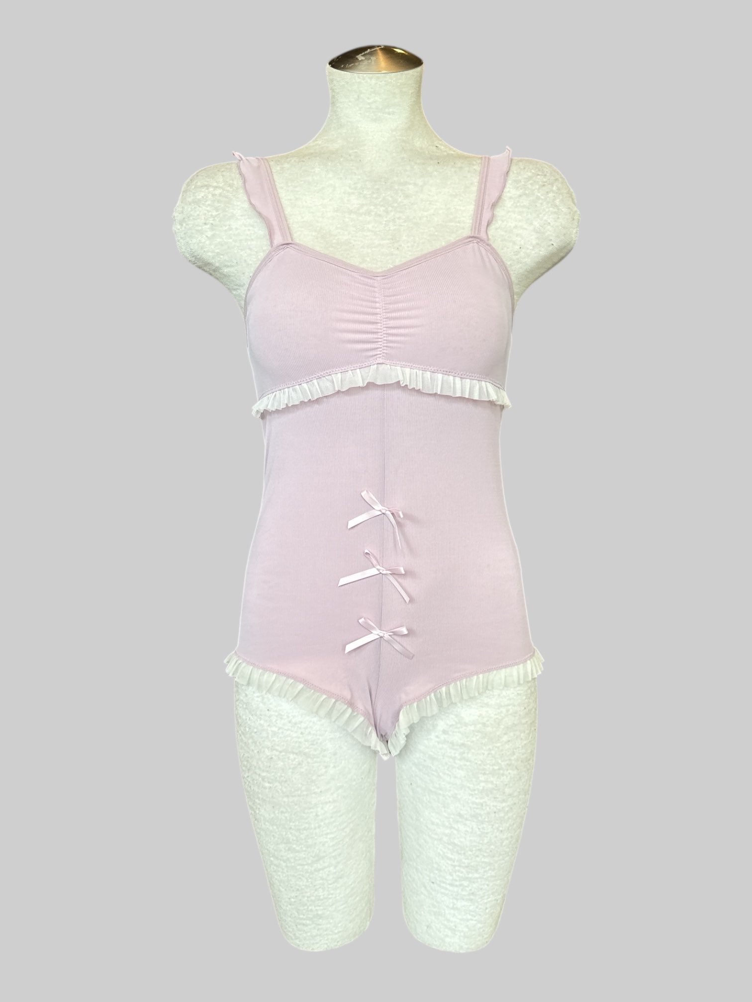 S Stretchy pink romper with ruffle details and bows