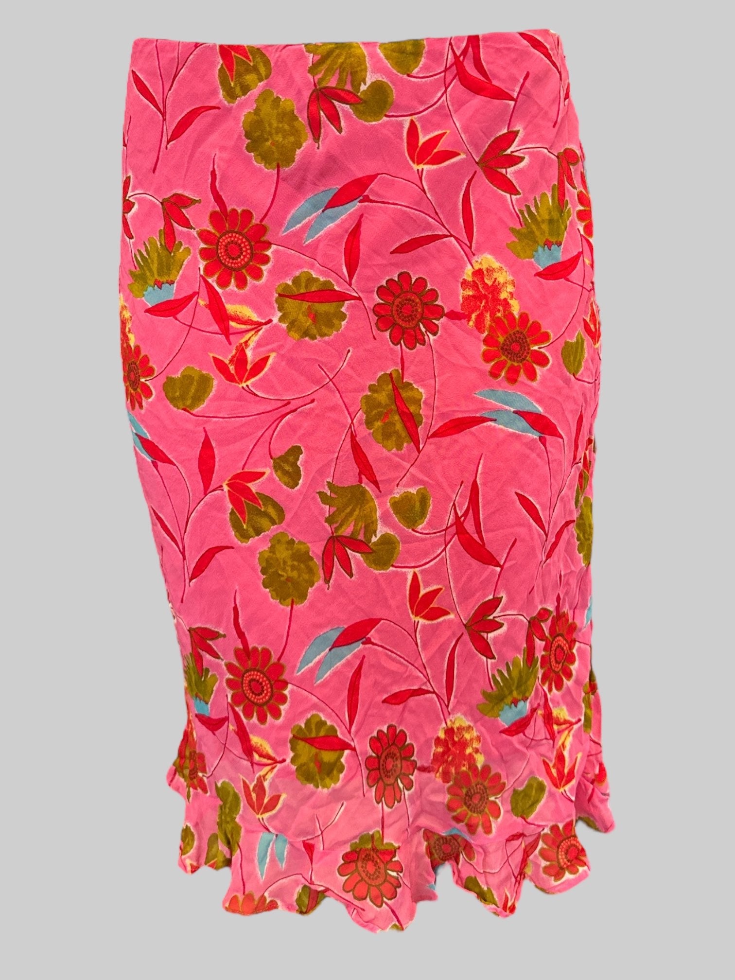 M Vintage tight fitting pink midi length skirt with red, green, blue florals, and side zipper and clasp