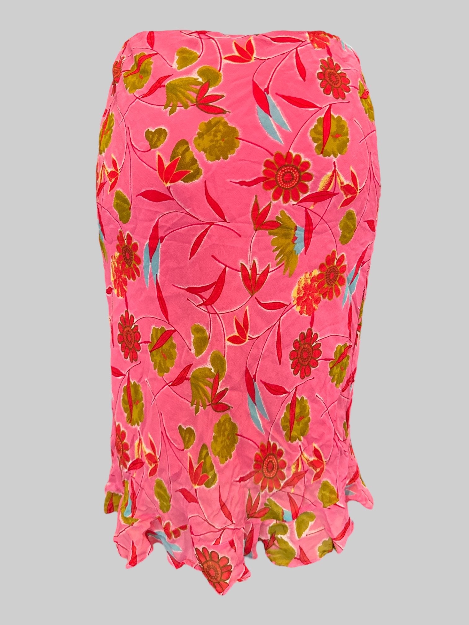 M Vintage tight fitting pink midi length skirt with red, green, blue florals, and side zipper and clasp