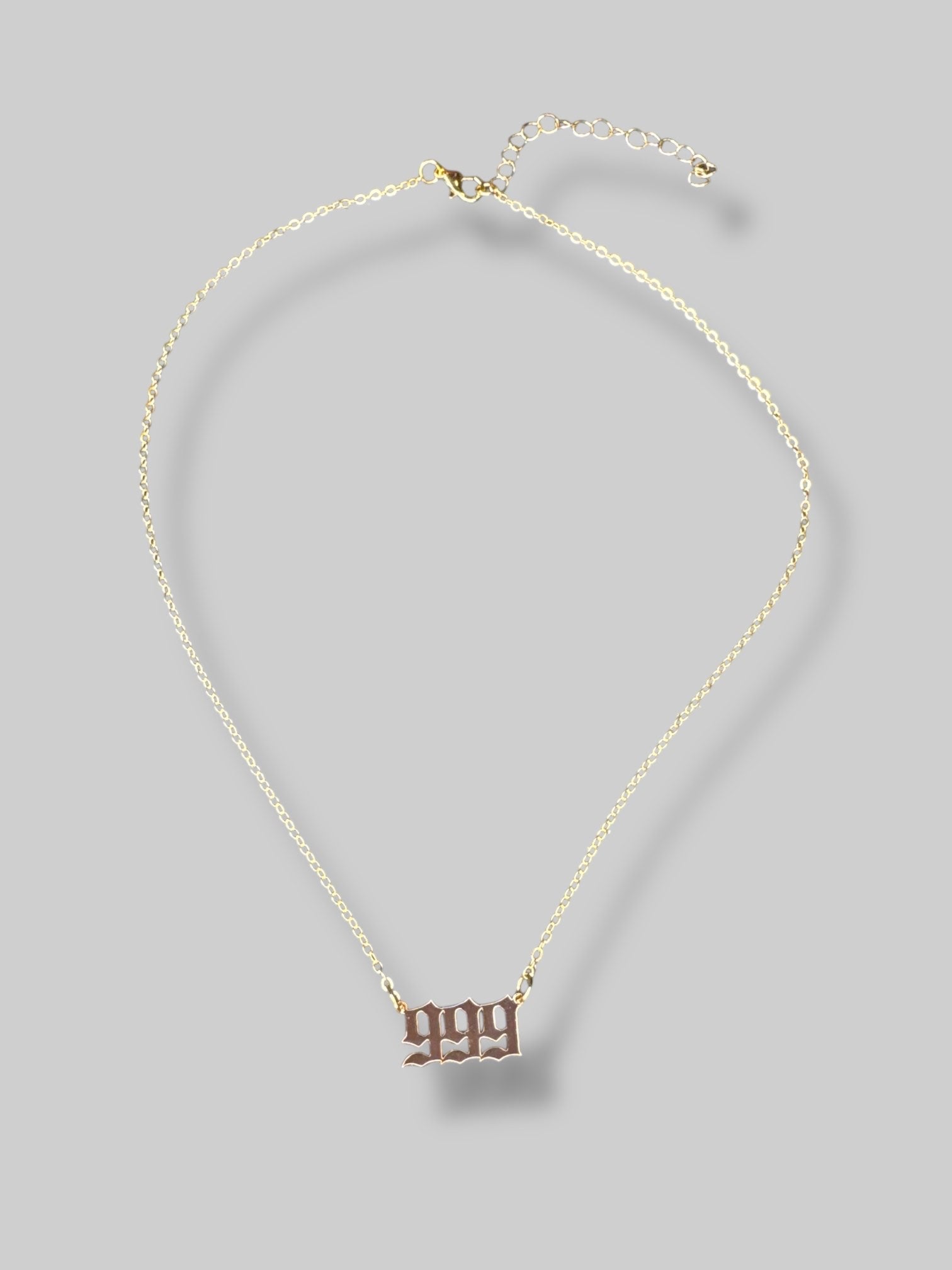 Gold tone 999 angel number necklace