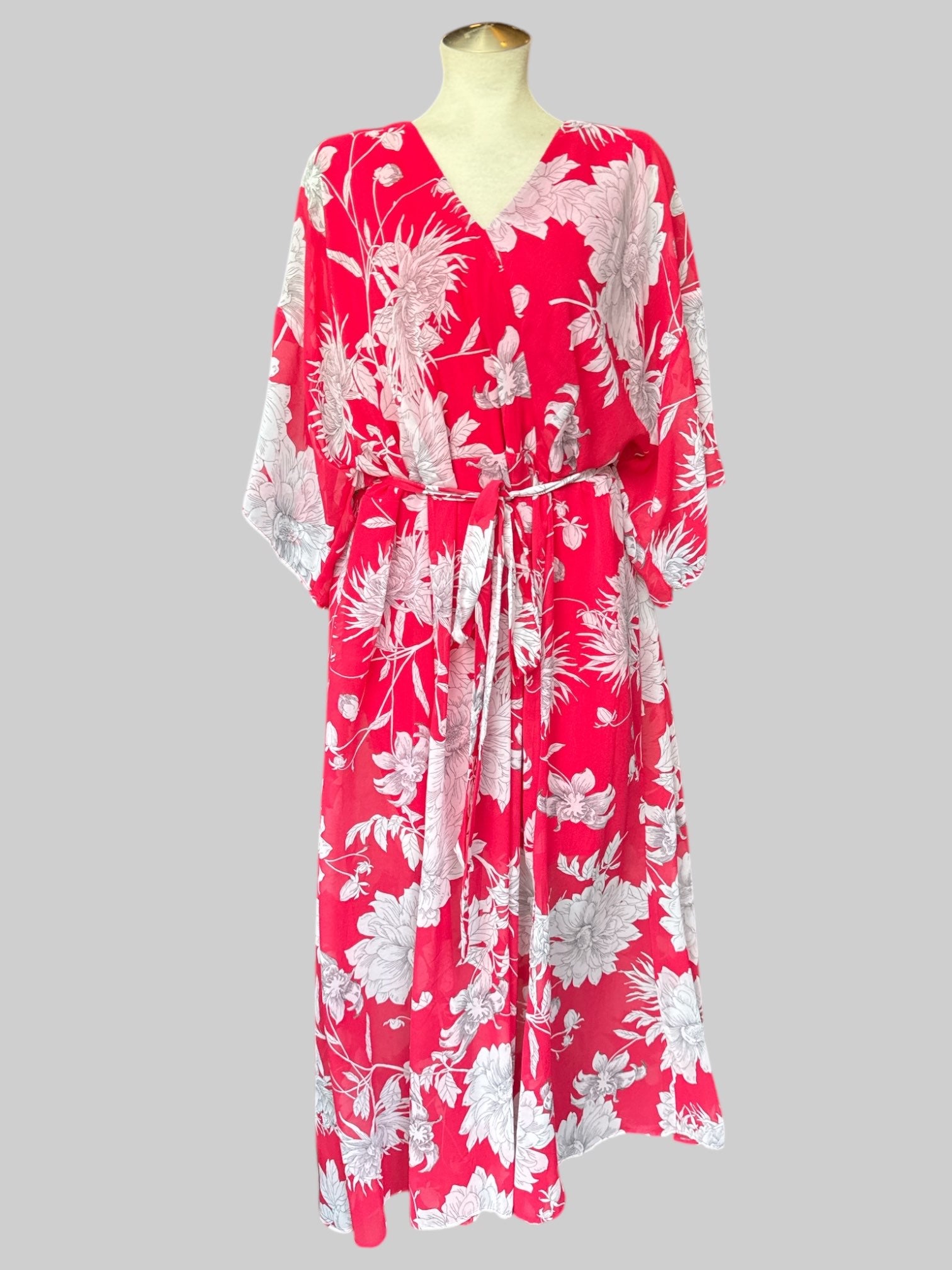 1X Reddish pink flowy dress with white florals, tie belt, and leg slit