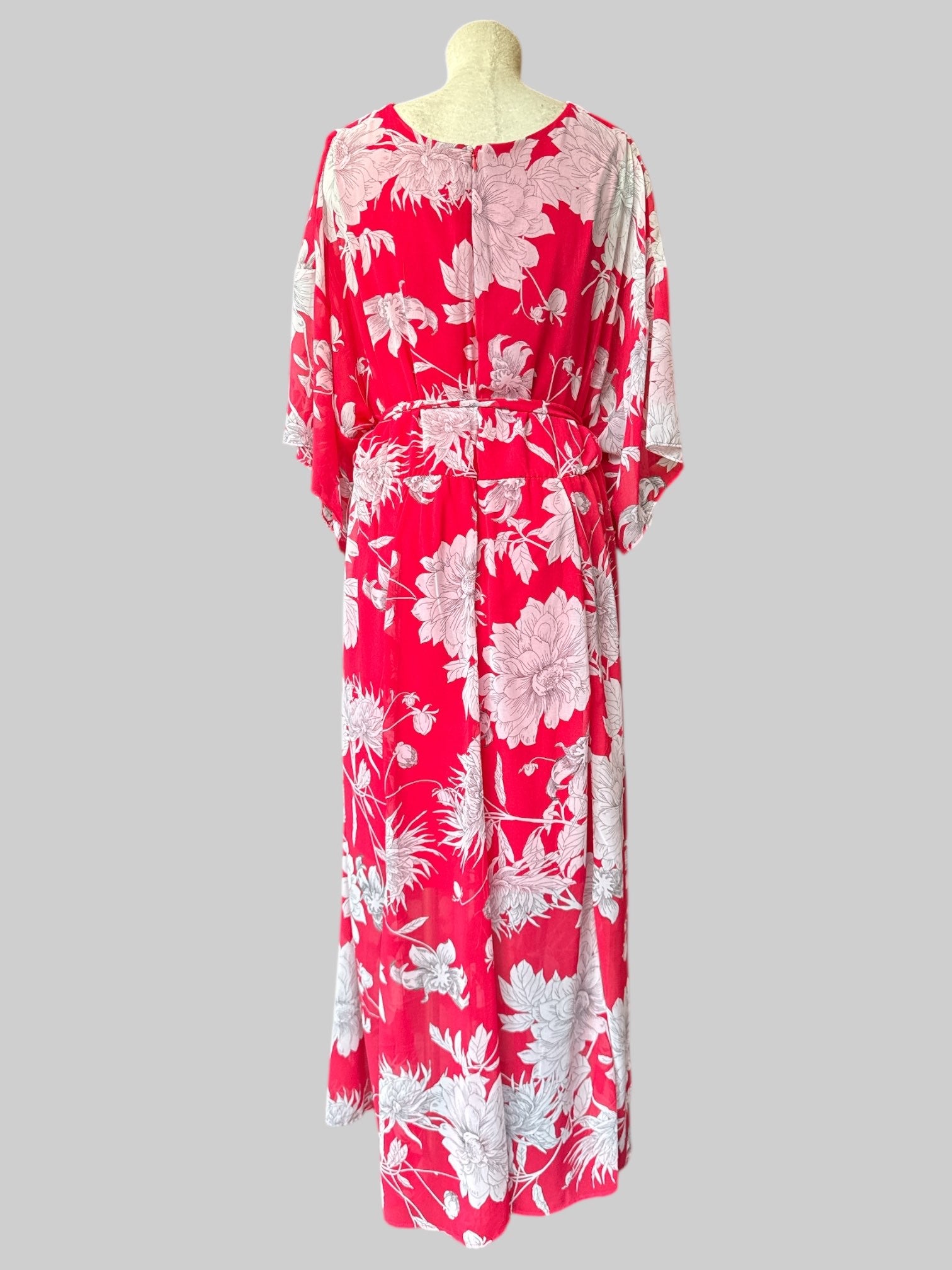 1X Reddish pink flowy dress with white florals, tie belt, and leg slit