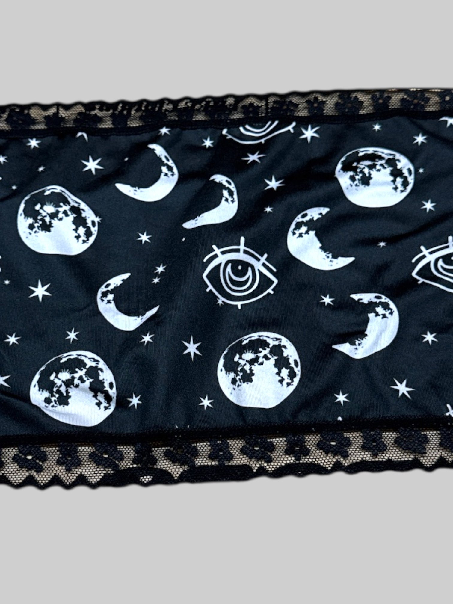 L black strapless top with celestial designs