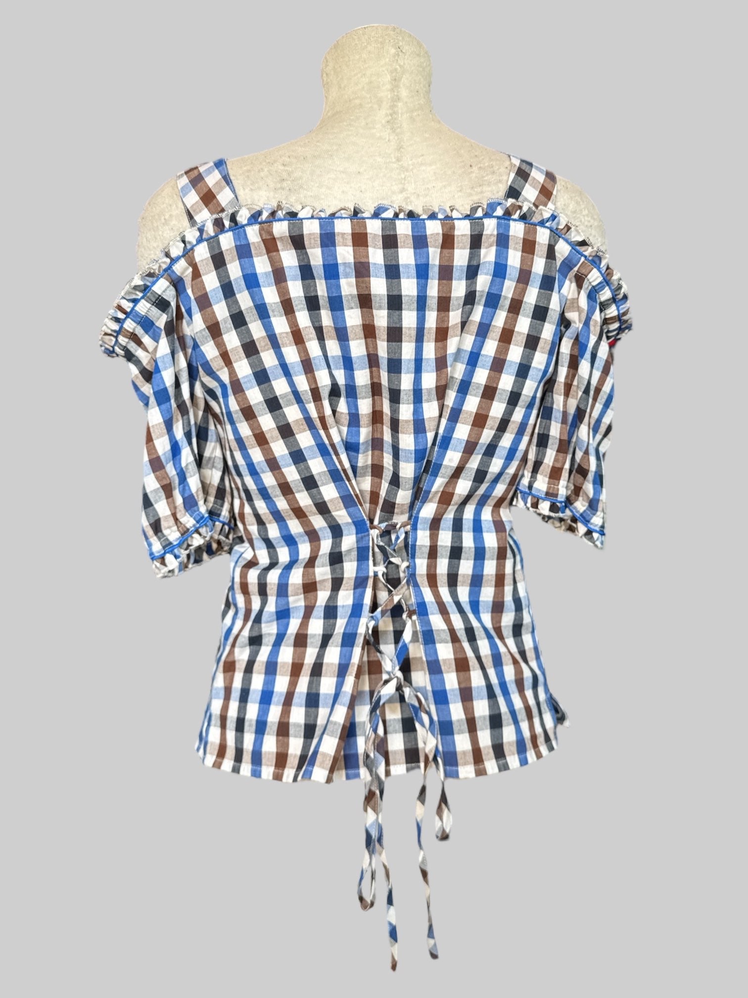 M Brown, white, blue, black gingham button up top with cold shoulders, heart strap buckles, ruffle details, and lace back