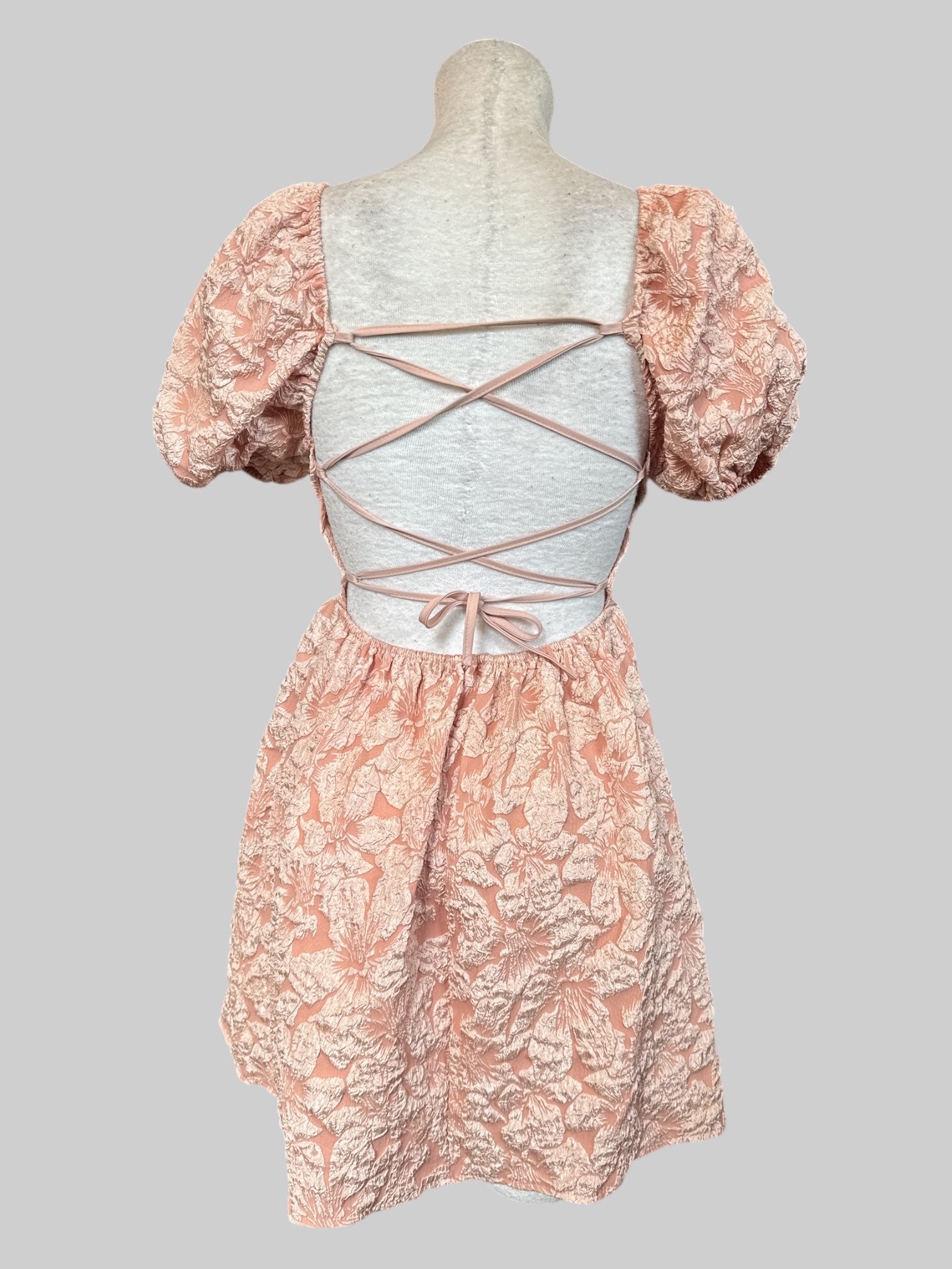 S Peachy pink dress with textured florals and lace up back