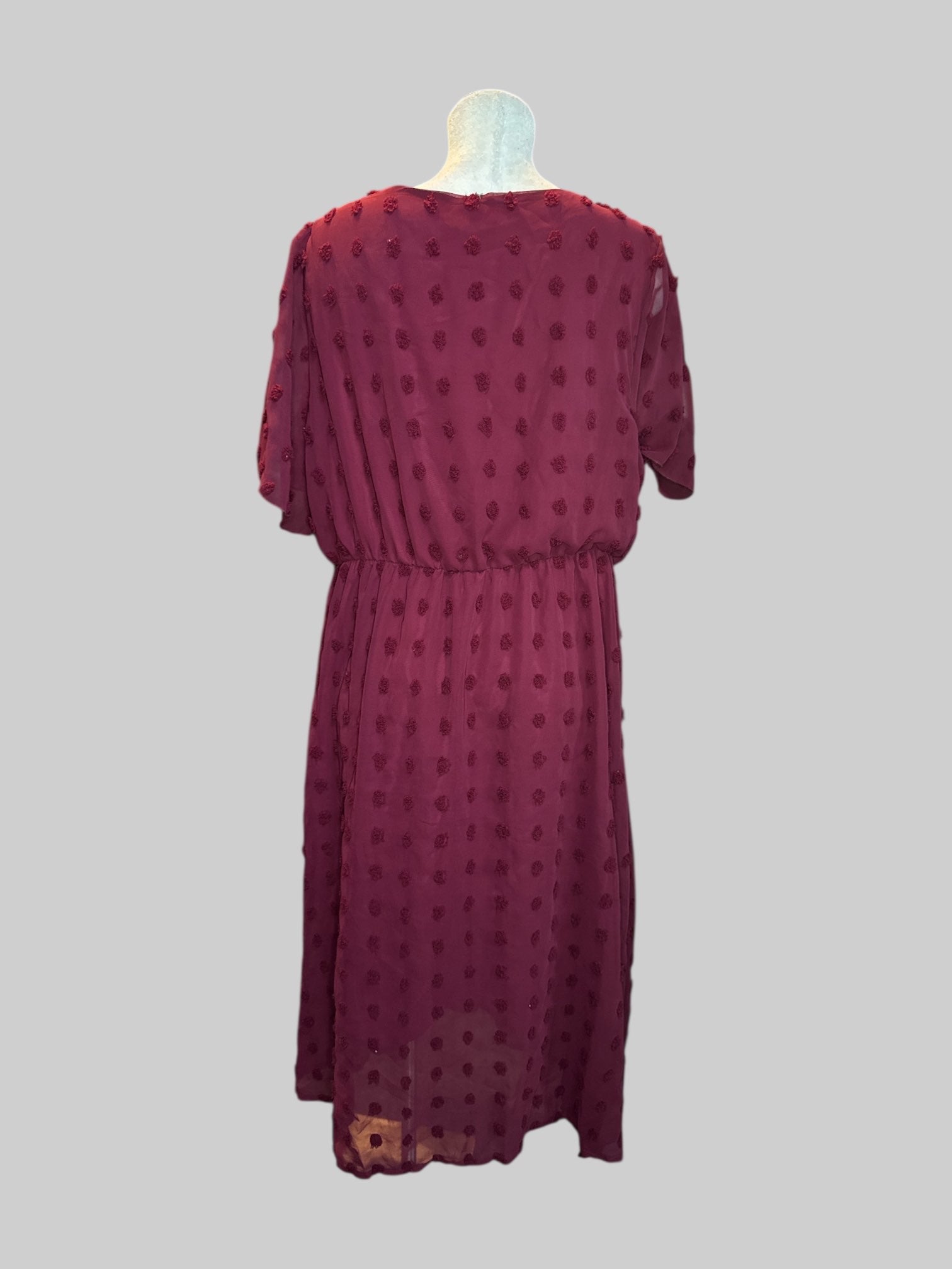 1X Burgundy textured faux wrap dress with sheer overlay and stretchy waste