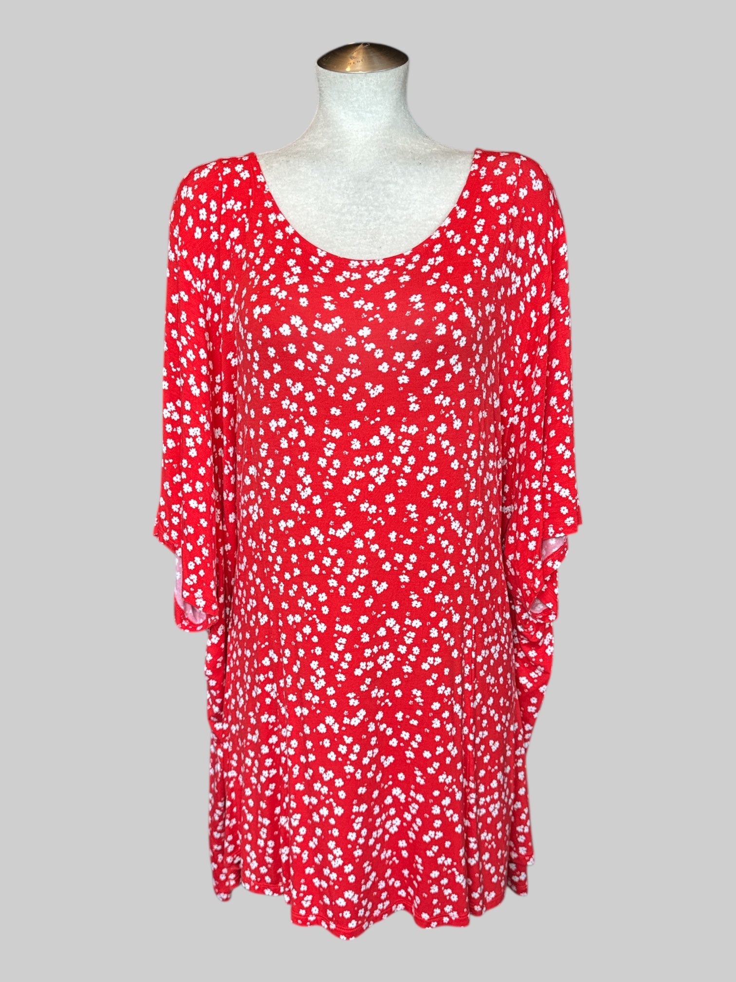 6X Flowy reddish orange top with white florals and back cut out
