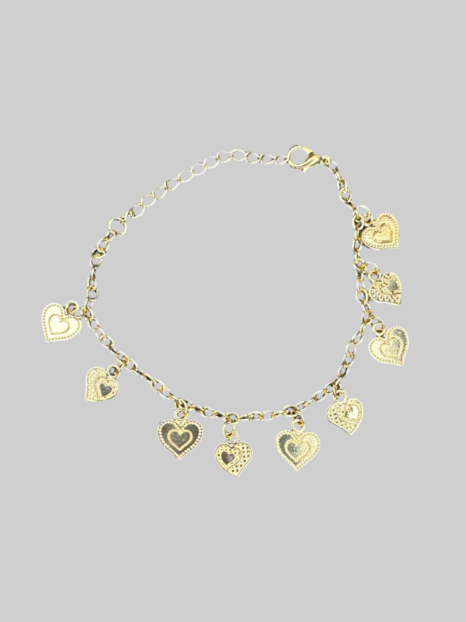 Gold tone heart charm bracelet