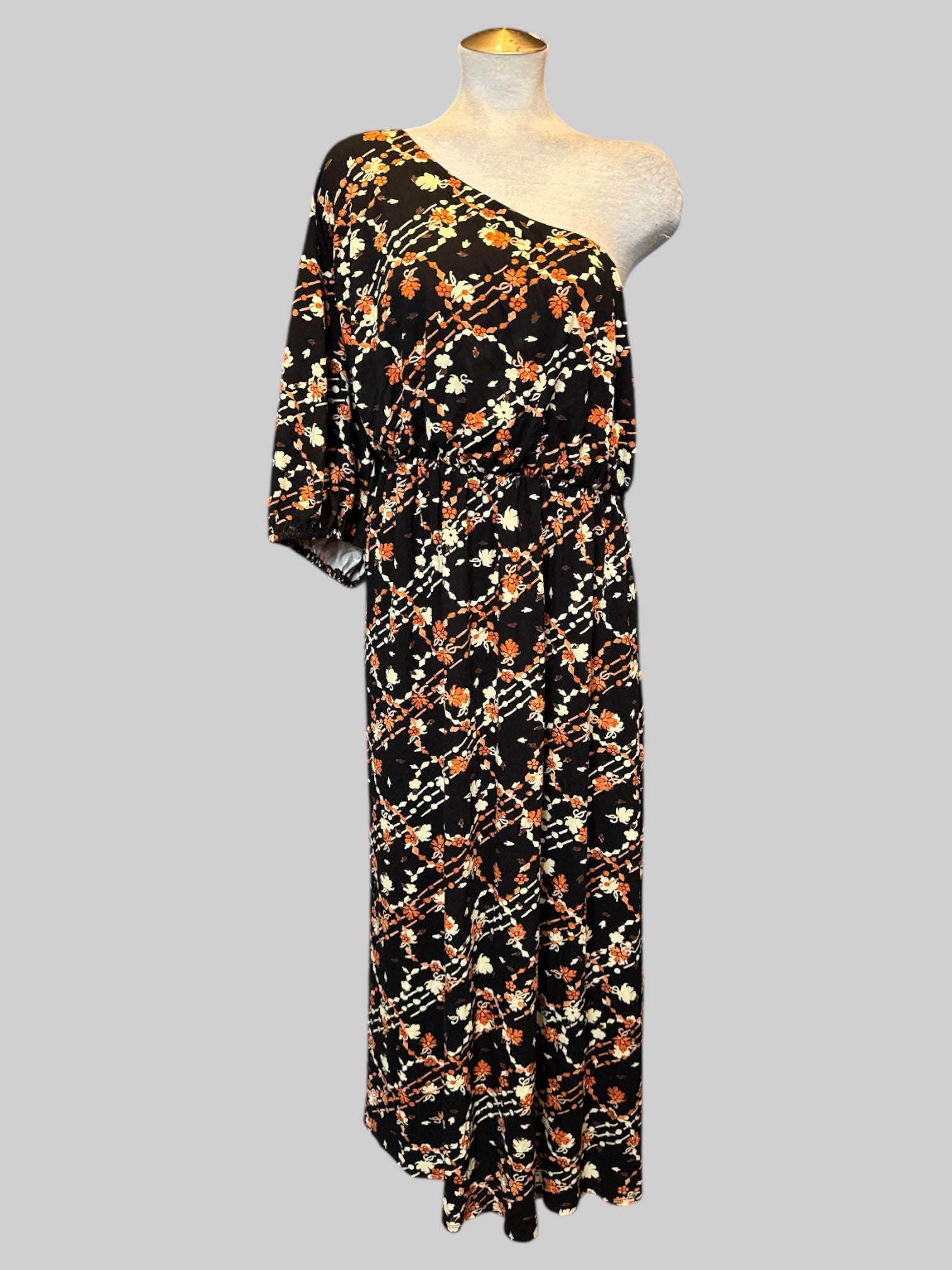 4X Flowy black one shoulder dress with  orange , white, and brown florals