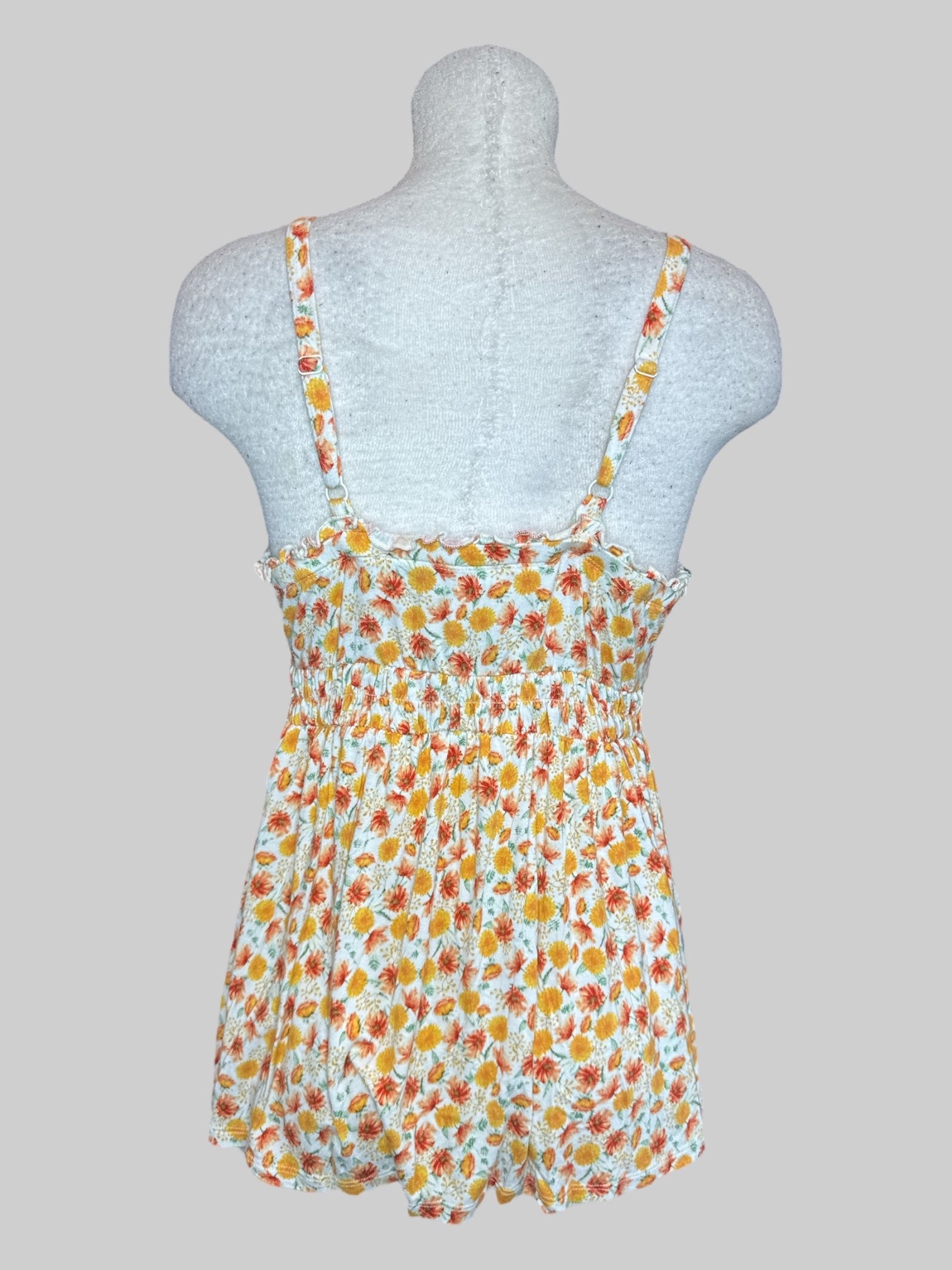 L White flowy tank top with orange and yellow florals and shirred  waist