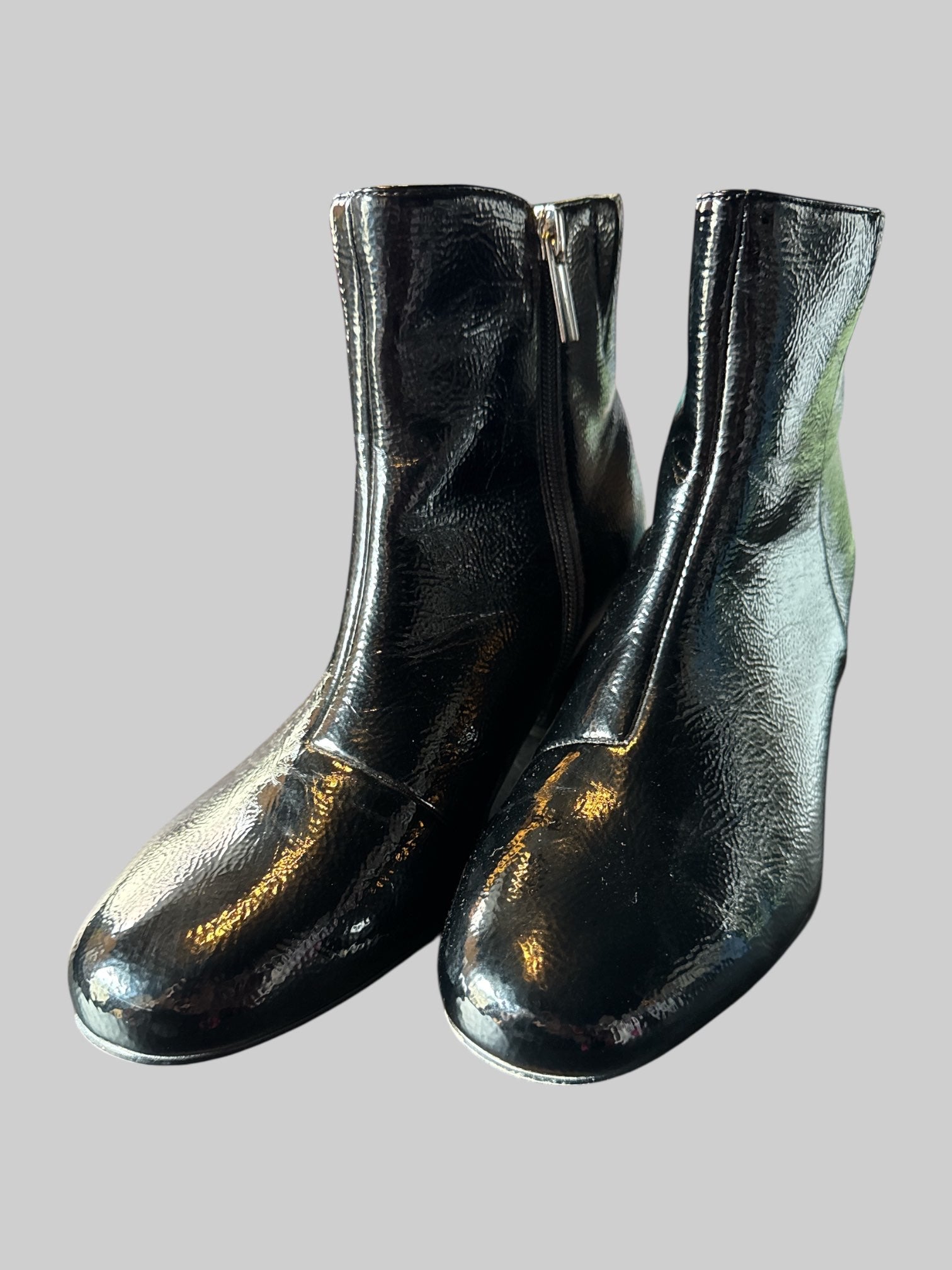 Size 8.5 women’s black leather ankle heel boots with zippers on sides