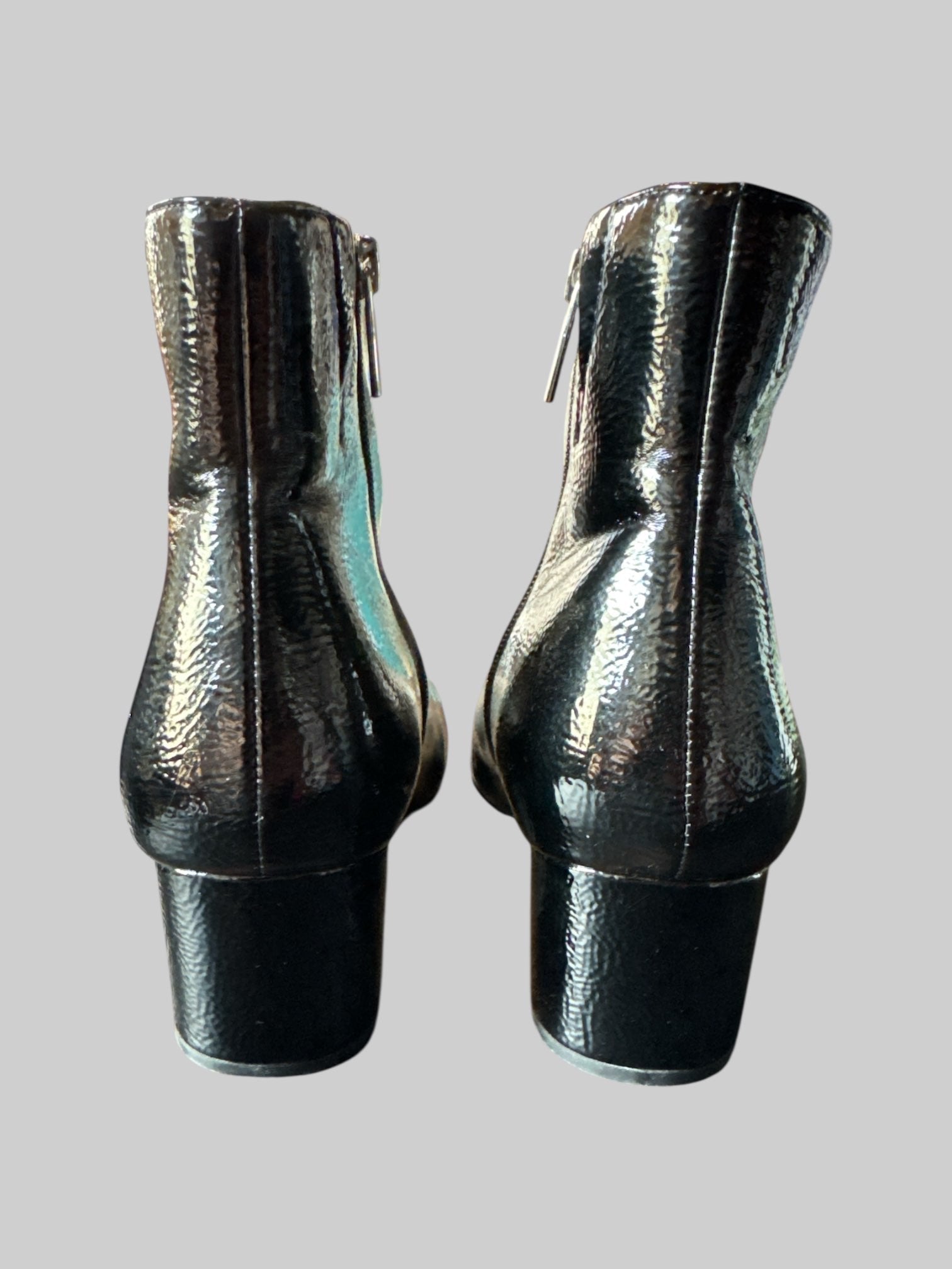 Size 8.5 women’s black leather ankle heel boots with zippers on sides