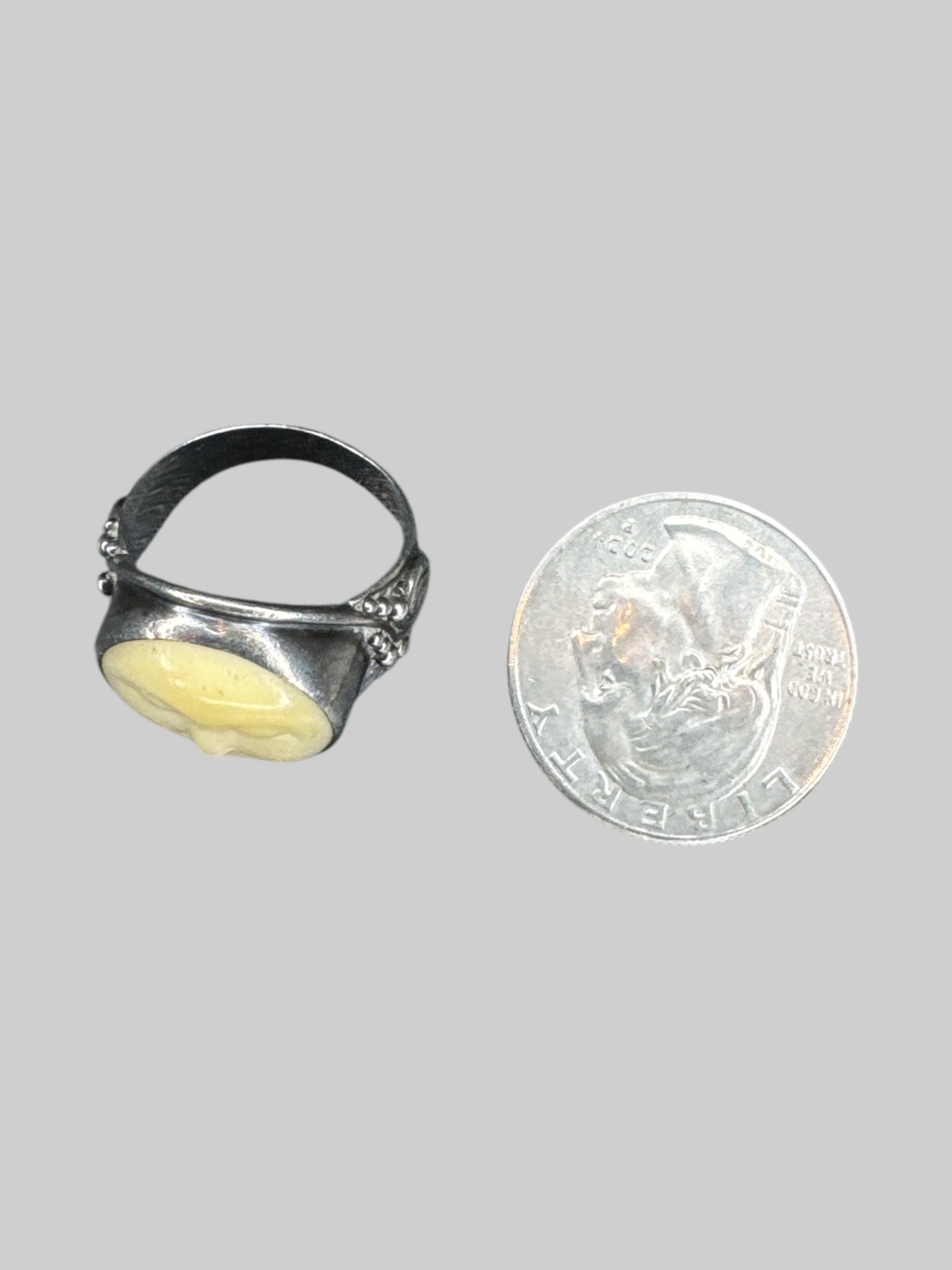 Size 7 vintage sterling silver ring with carved face adornment