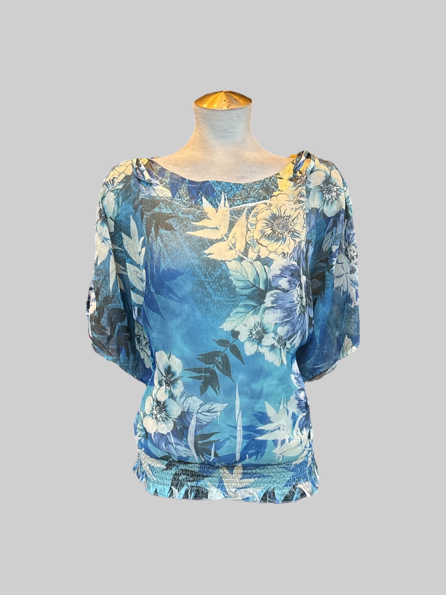XL blue and white floral top with sheer layer, cold shoulders with ties, and shirred waist