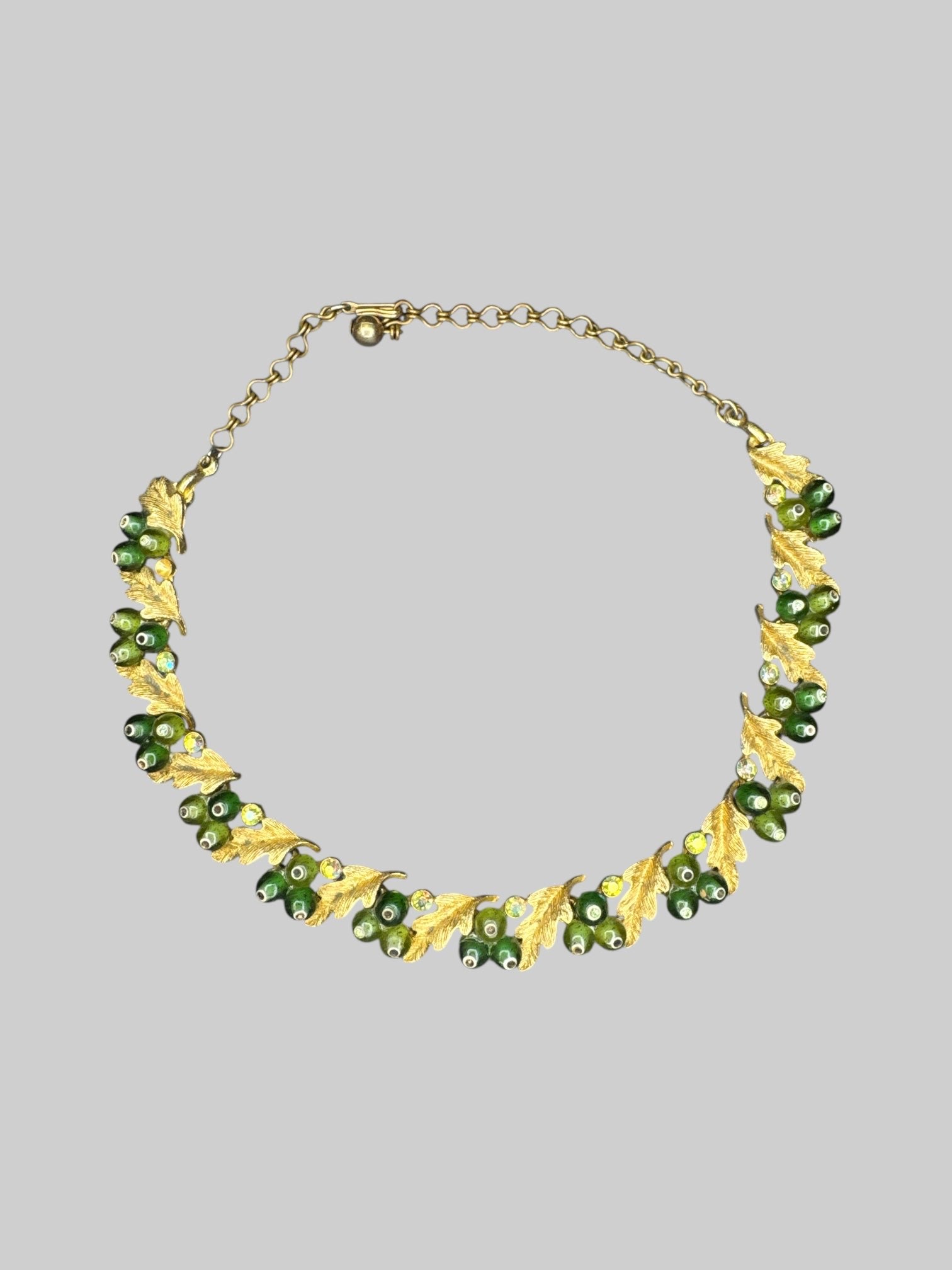 B.S.K. designer vintage 50’s/60s gold tone leaf necklace with green gems