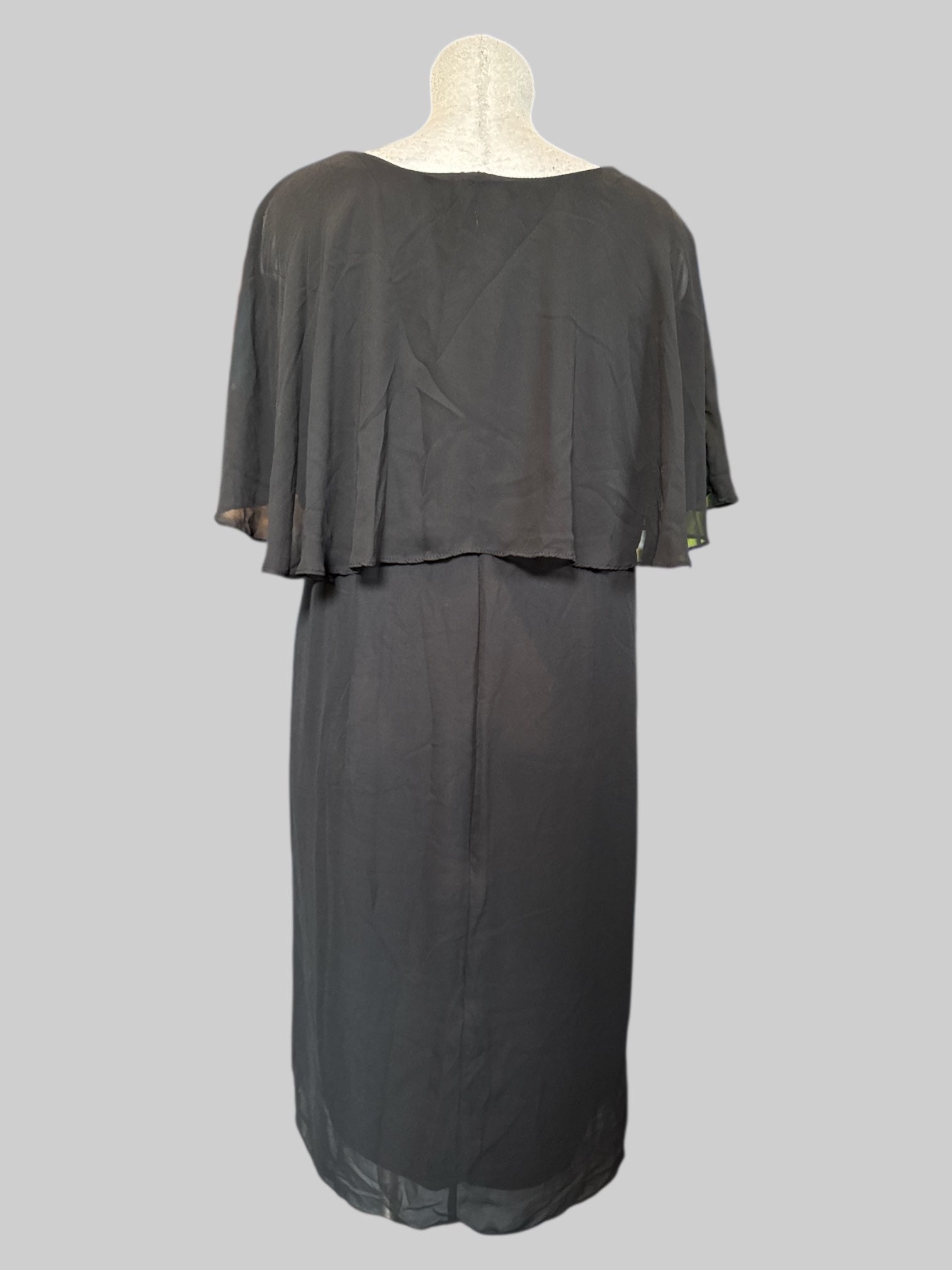 1X Black flowy dress with sheer overlay on top and some pleating