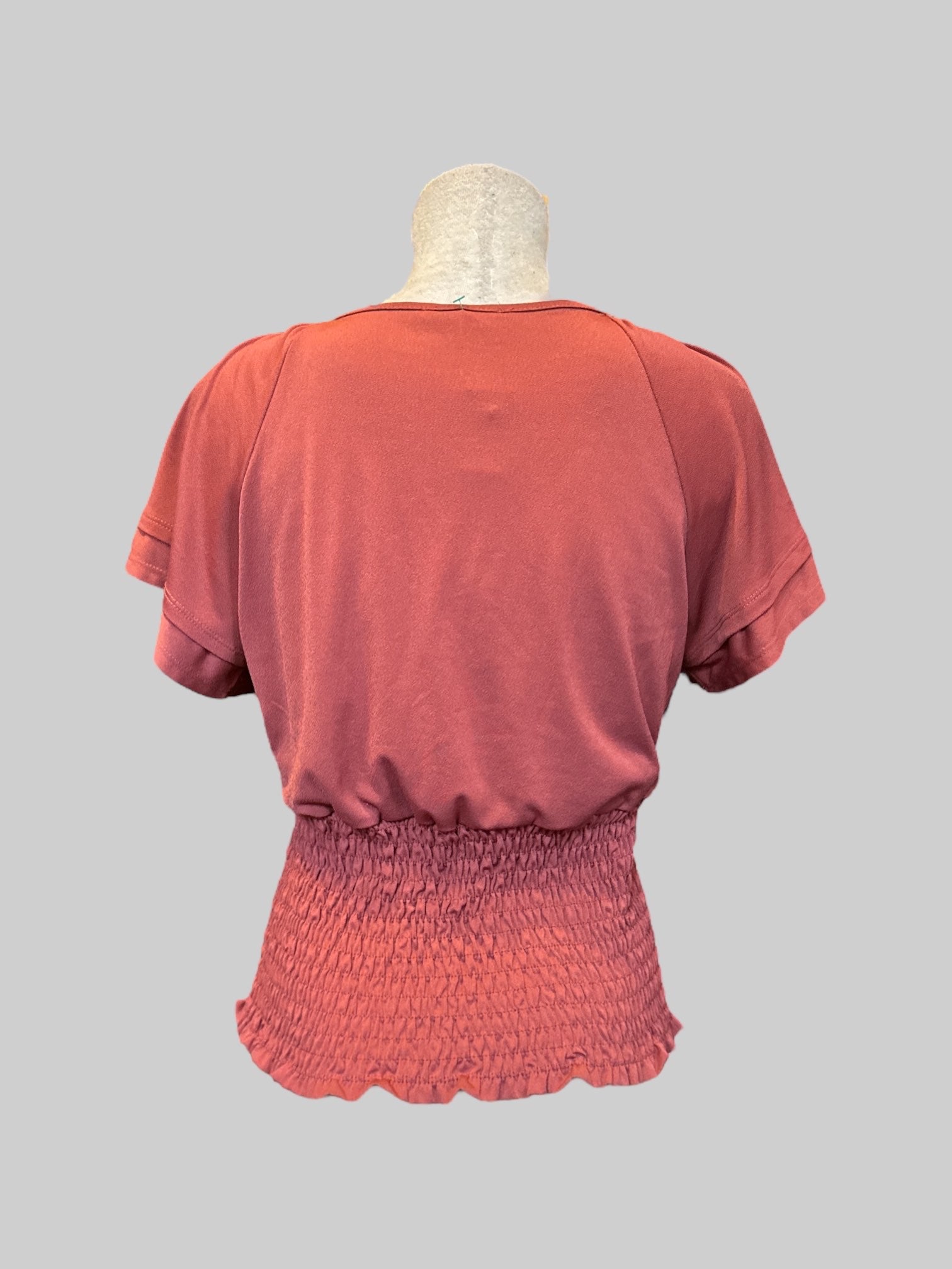 L Burnt orange short sleeve top with flowy layered sleeves and shirred bodice