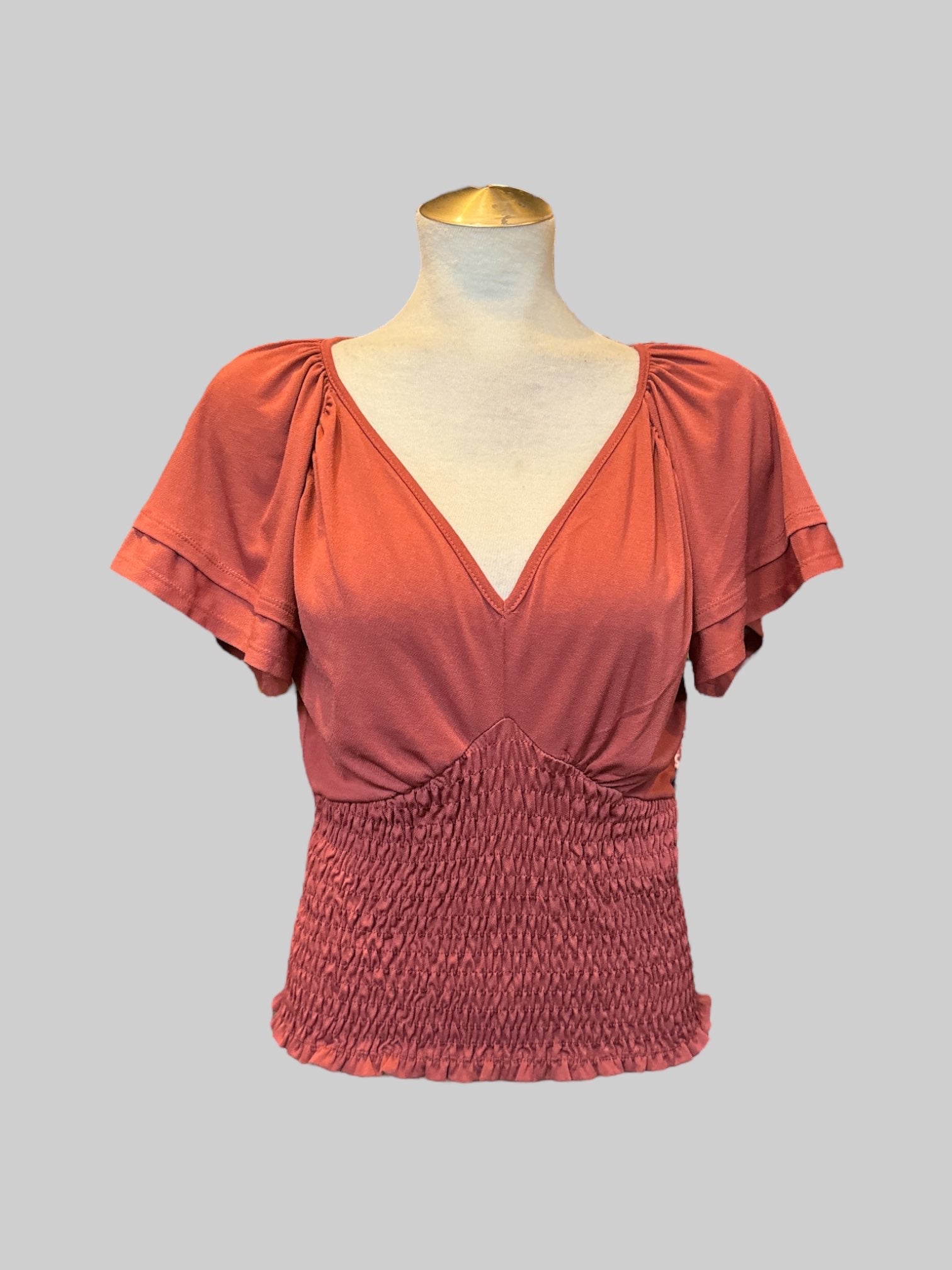 L Burnt orange short sleeve top with flowy layered sleeves and shirred bodice