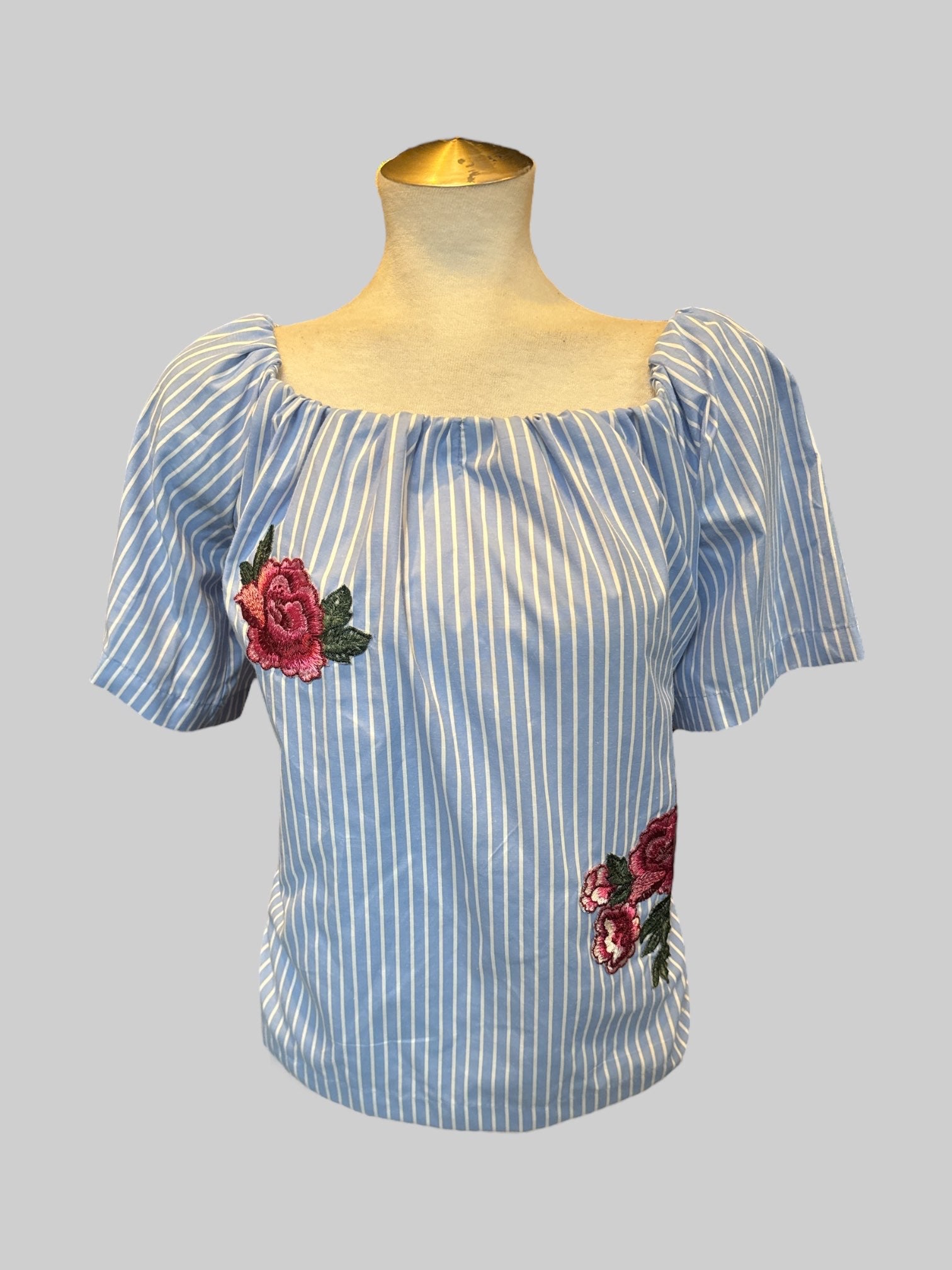L Blue and white striped top with the elastic neckline and floral embroidery
