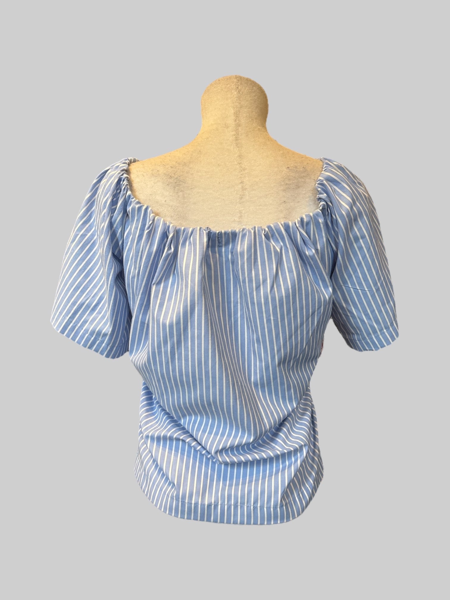 L Blue and white striped top with the elastic neckline and floral embroidery