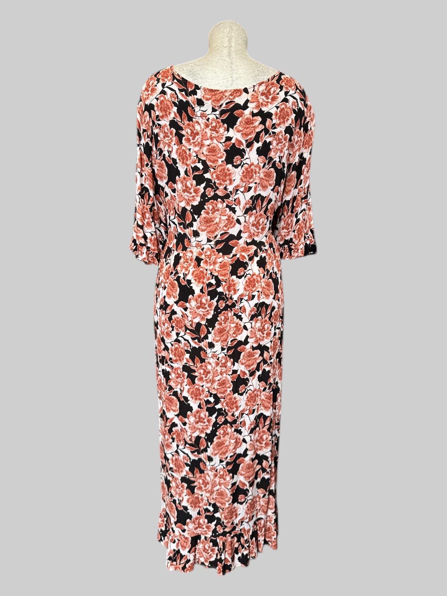 2X Black and white flowy dress with orange florals and ruffle hem