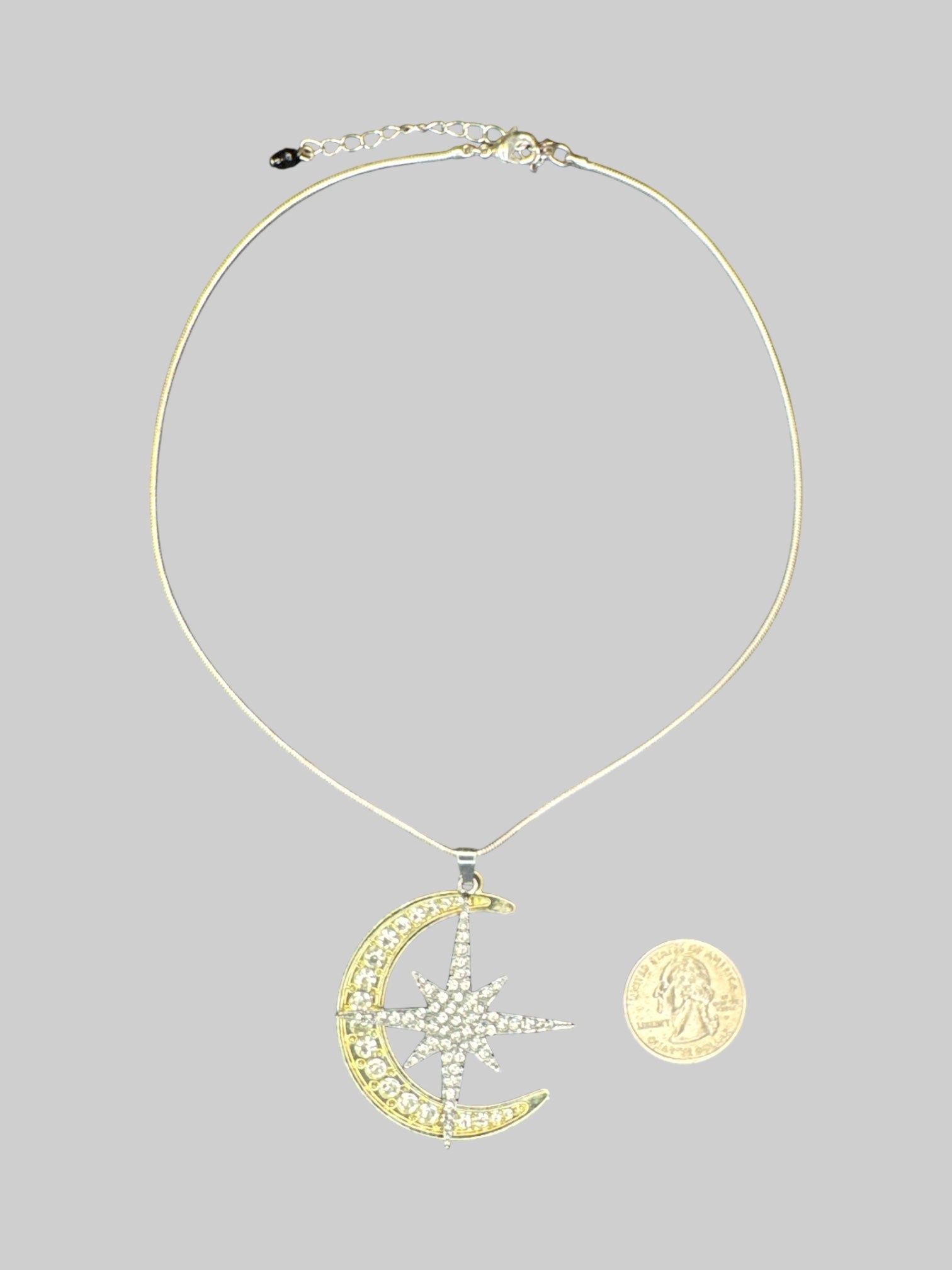 Adjustable necklace with gold moon and silver star rhinestoned pendants
