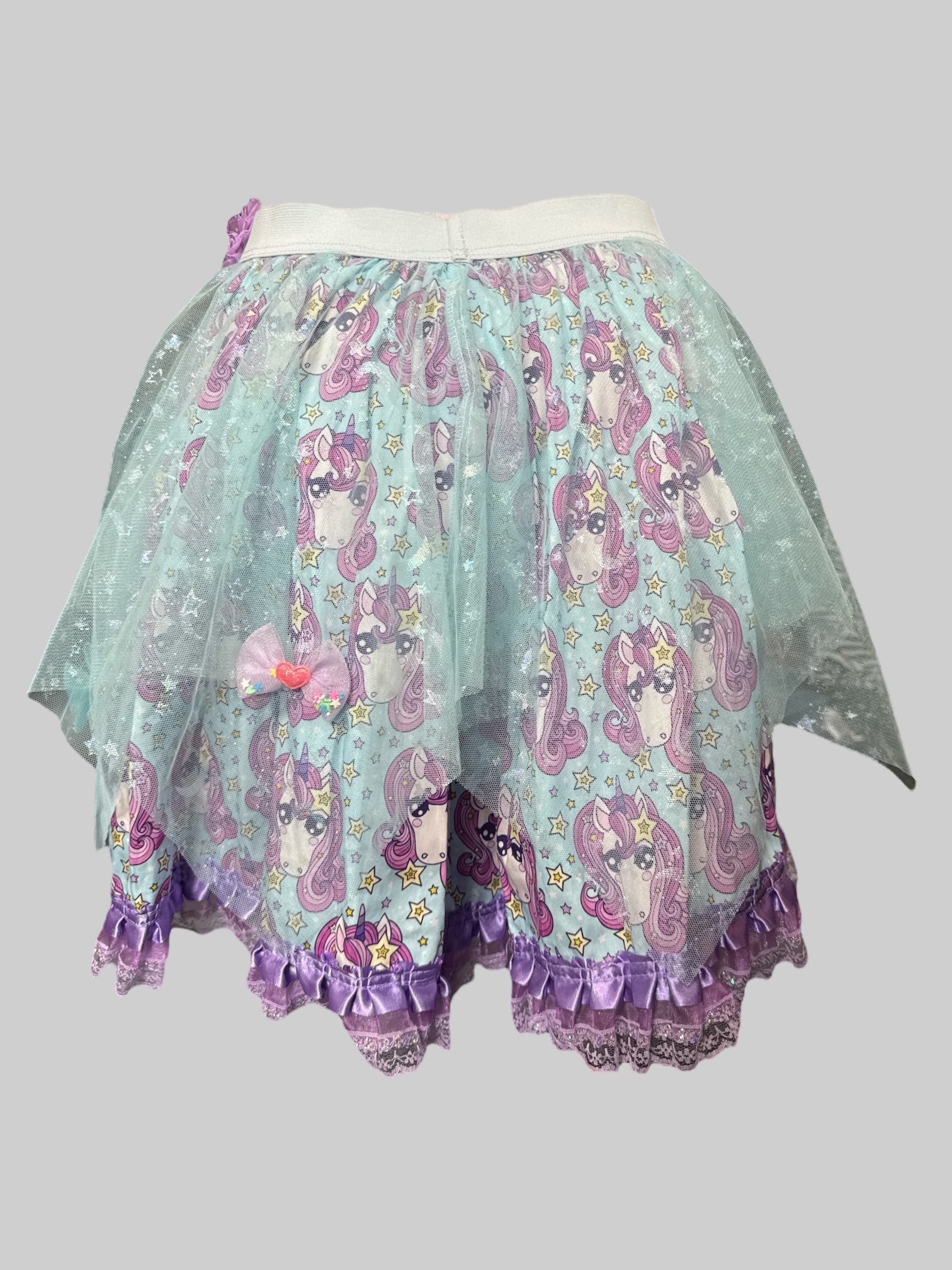 L Blue skirt with pink unicorns, yellow stars, little bows with hearts, blue tulle overlay with glittery stars and moons, and elastic waistband