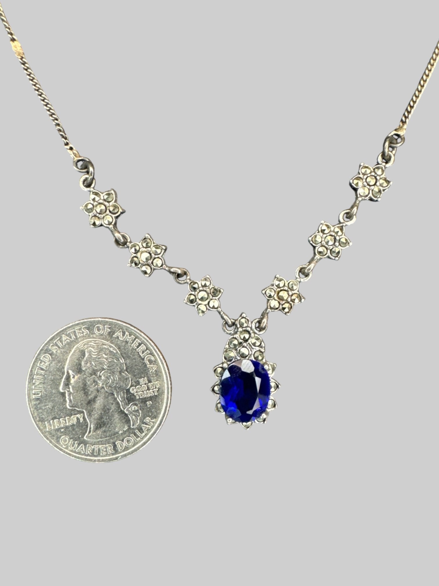Sapphire tone pendant necklace with rhinestone flowers