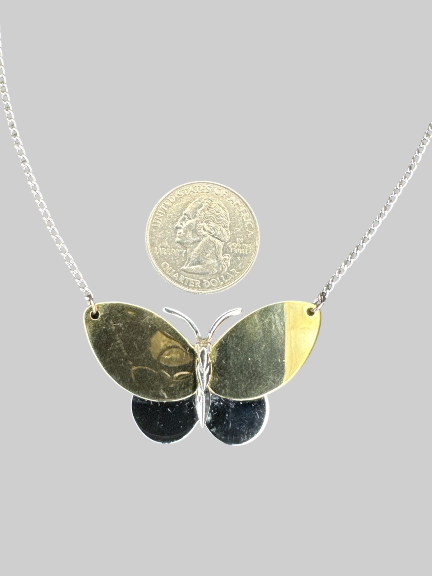 Vintage Avon chain necklace with gold and silver toned butterfly pendant