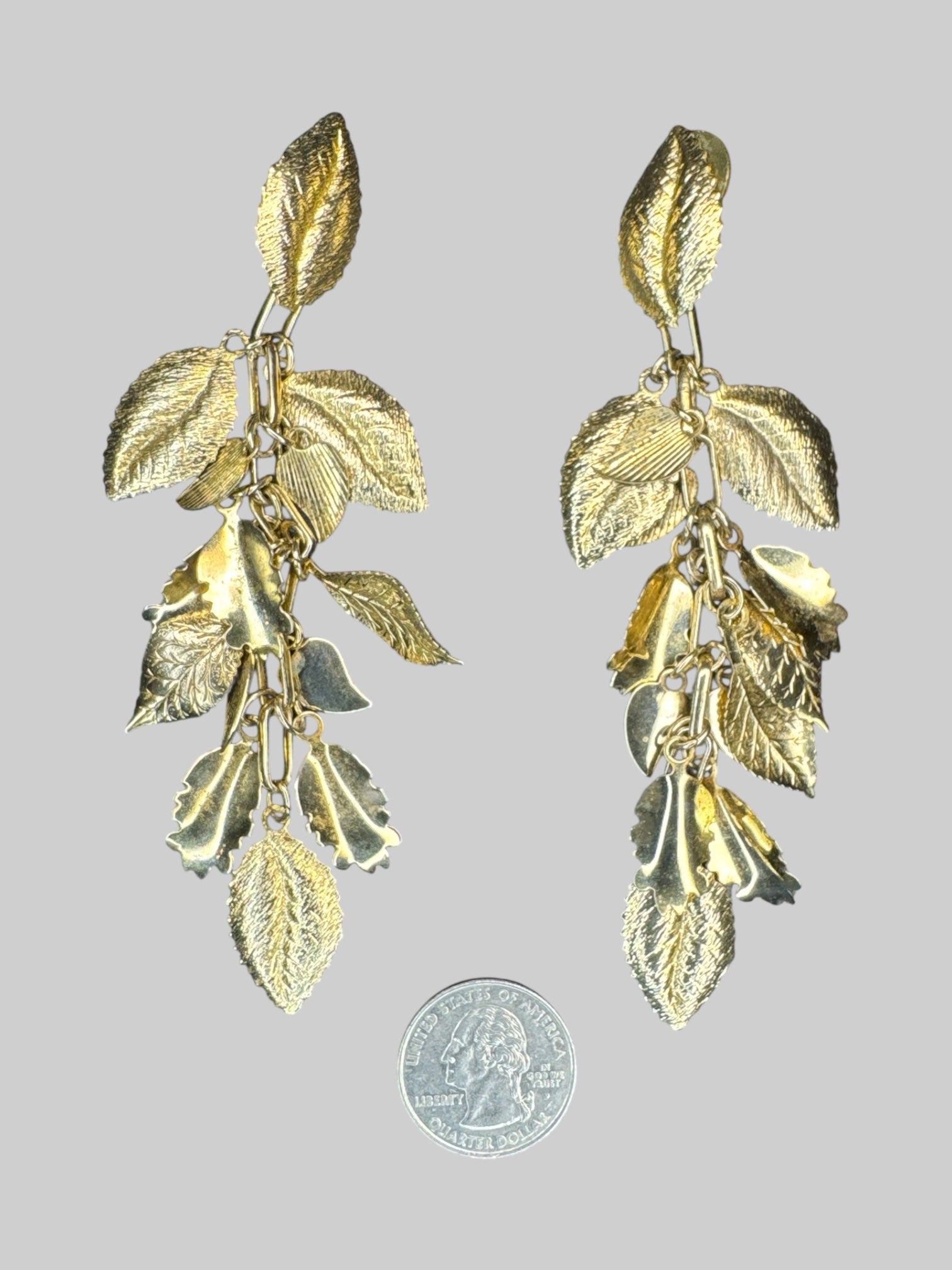 Gold tone dangley textured leaf earrings