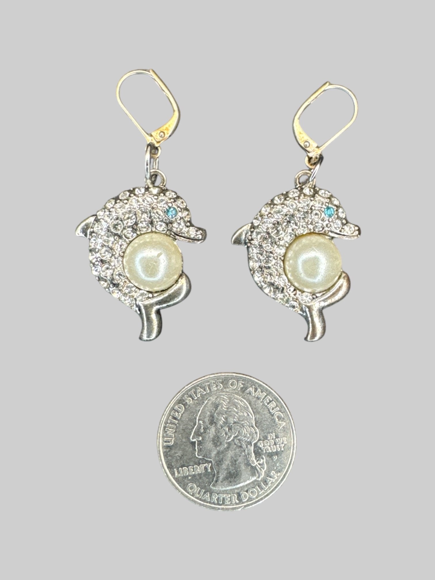 Rhinestoned dolphin earrings with faux pearls and clasp closure