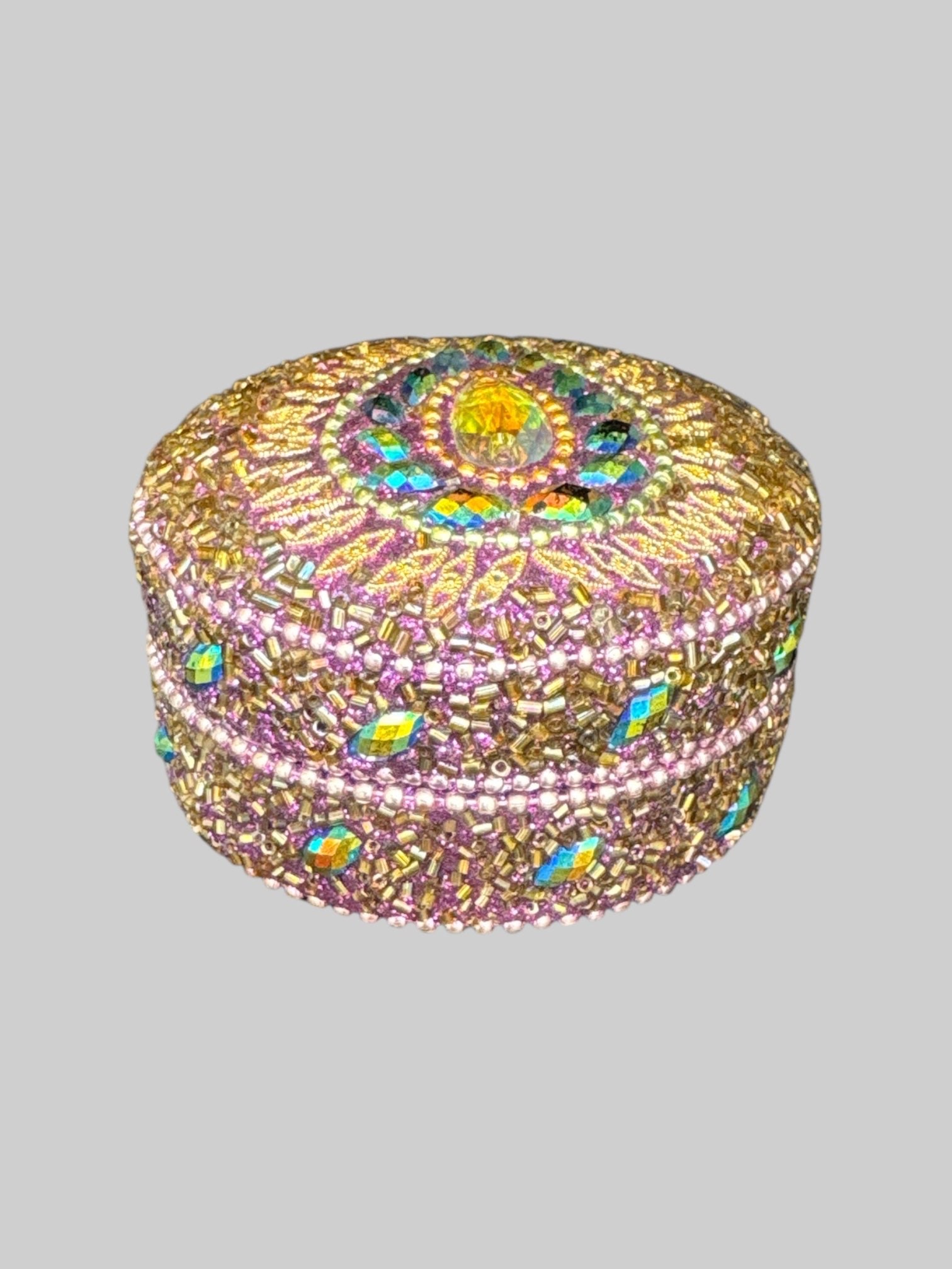 Purple, gold, and iridescent bedazzled metal box