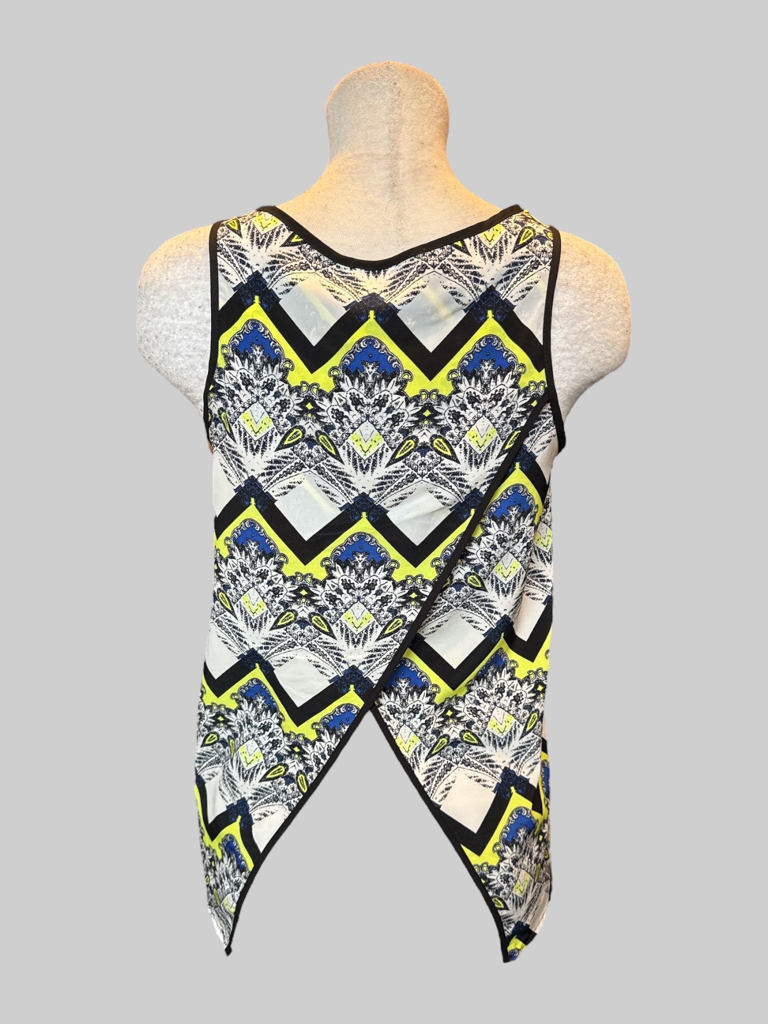 M Black, white, yellow, and blue sleeveless top with geometric, ornate design and split panel back