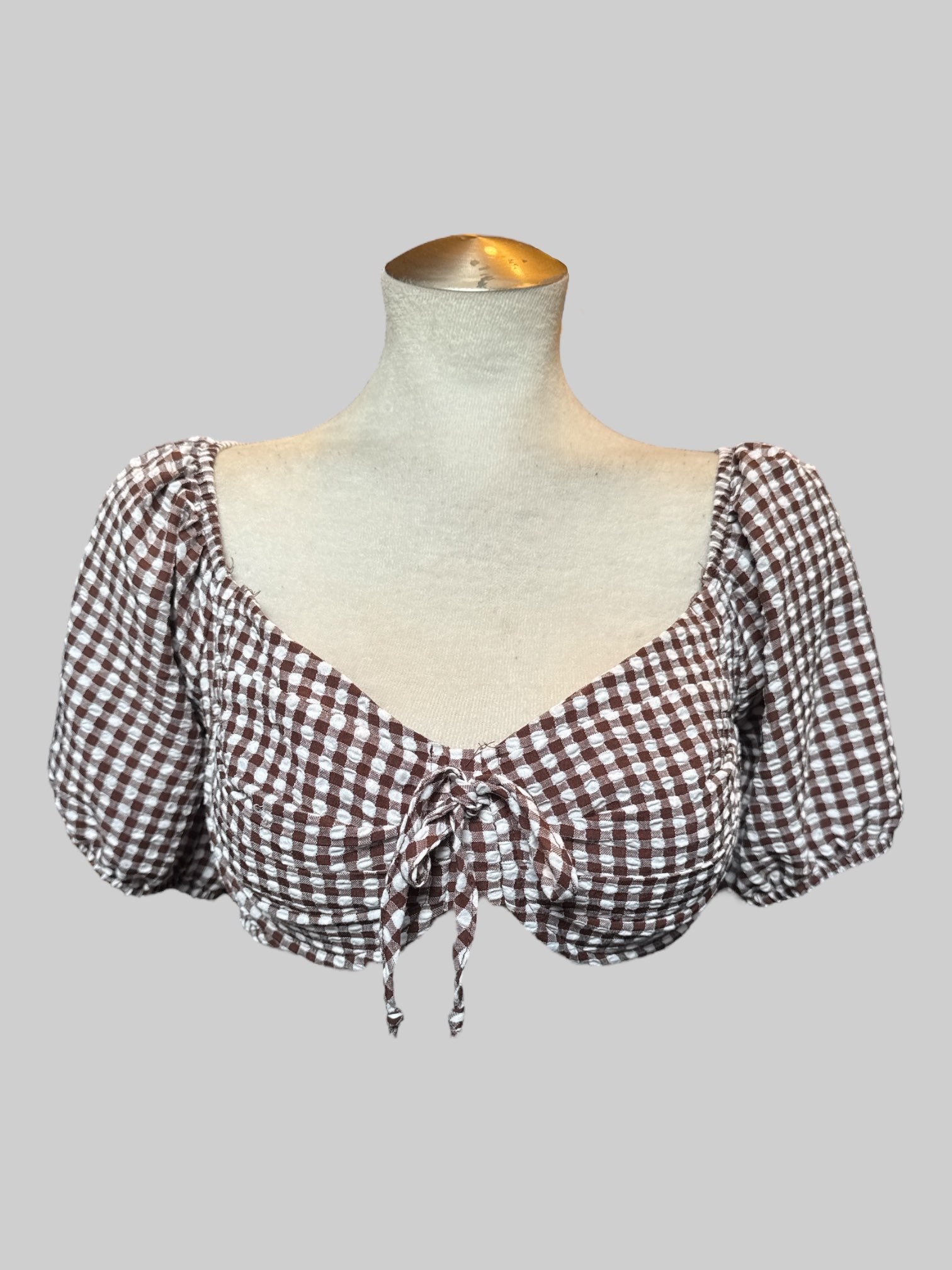L Brown and white gingham crop top with underwire, bowtie in front, and balloon sleeves