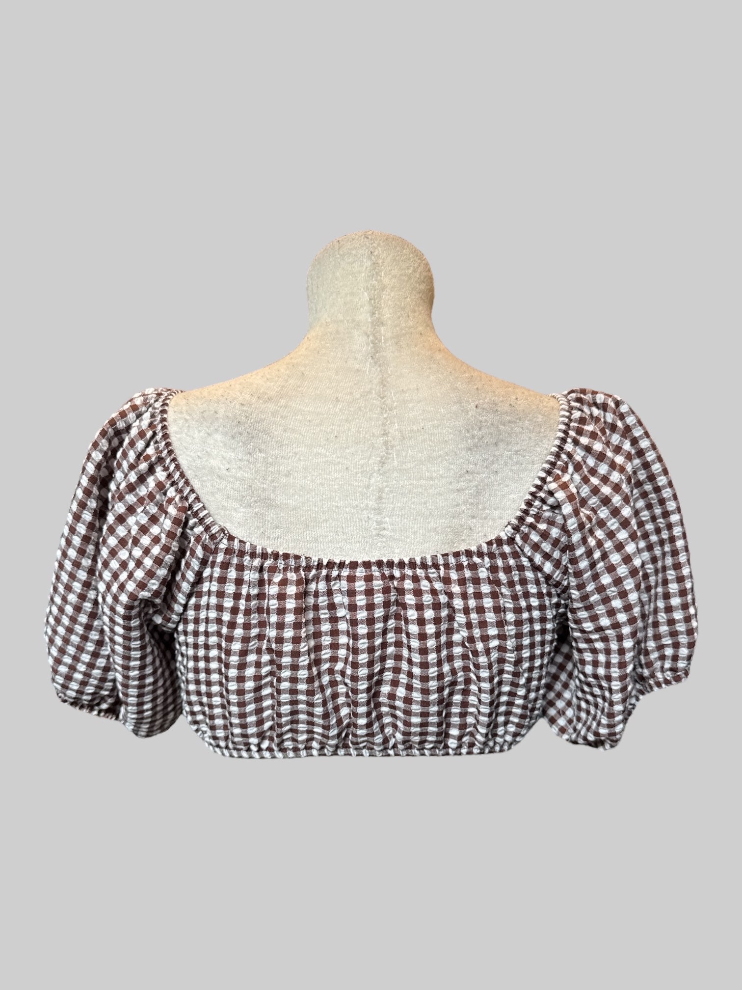 L Brown and white gingham crop top with underwire, bowtie in front, and balloon sleeves