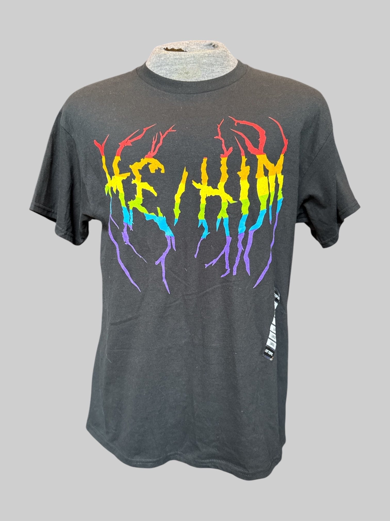 L Black T-shirt with rainbow “He/Him” graphic