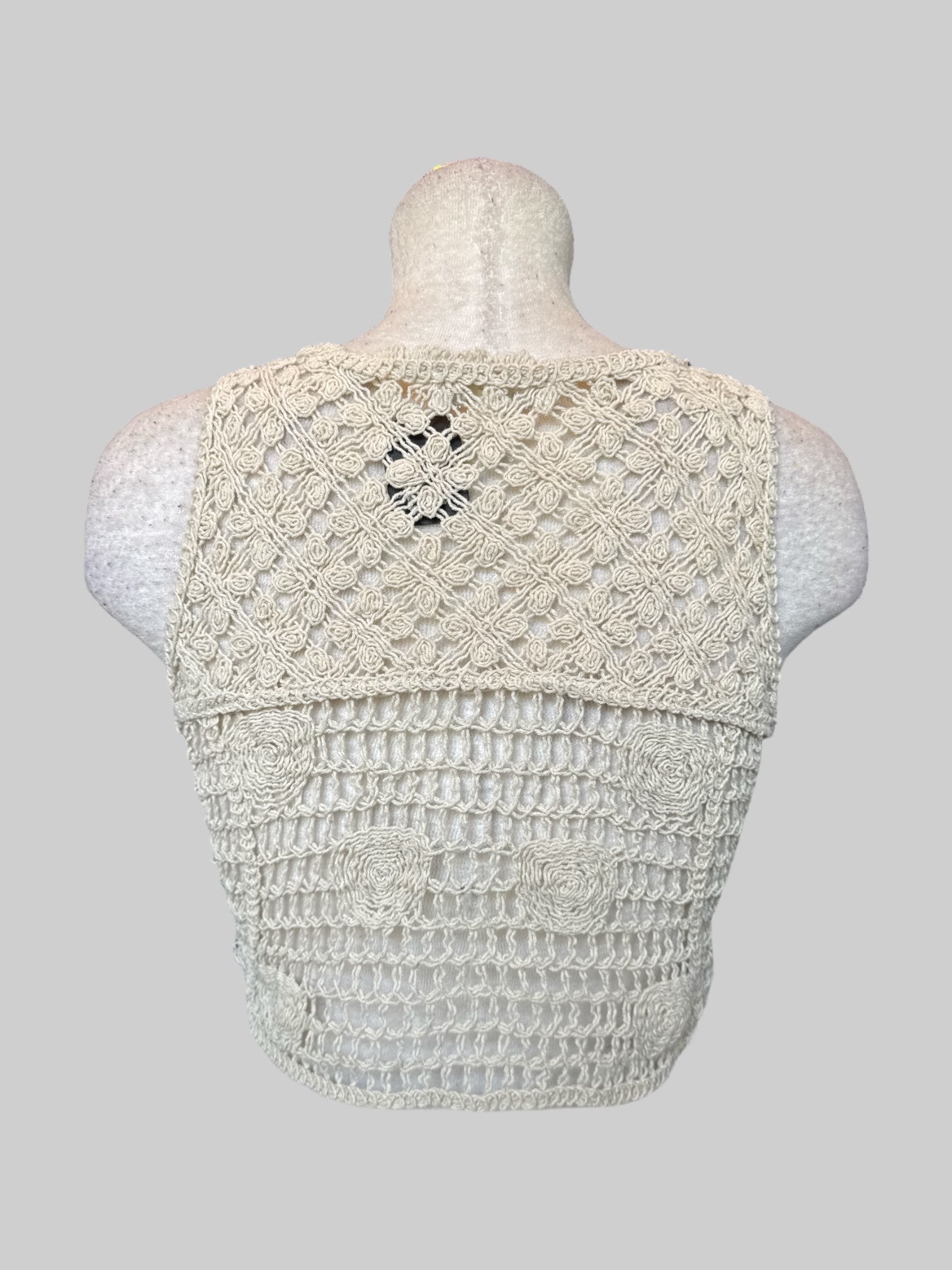 L Cream sleeveless crocheted crop top with sunflower embroidery, and buttons on front