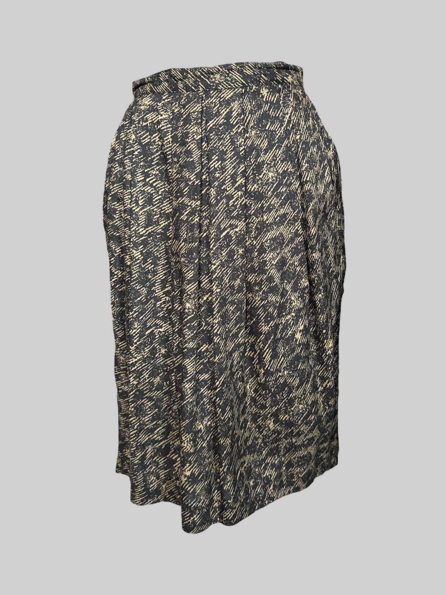 XS Vintage, brownish green and black pattern skirt with pleating, slit in the back, and zipper button closure