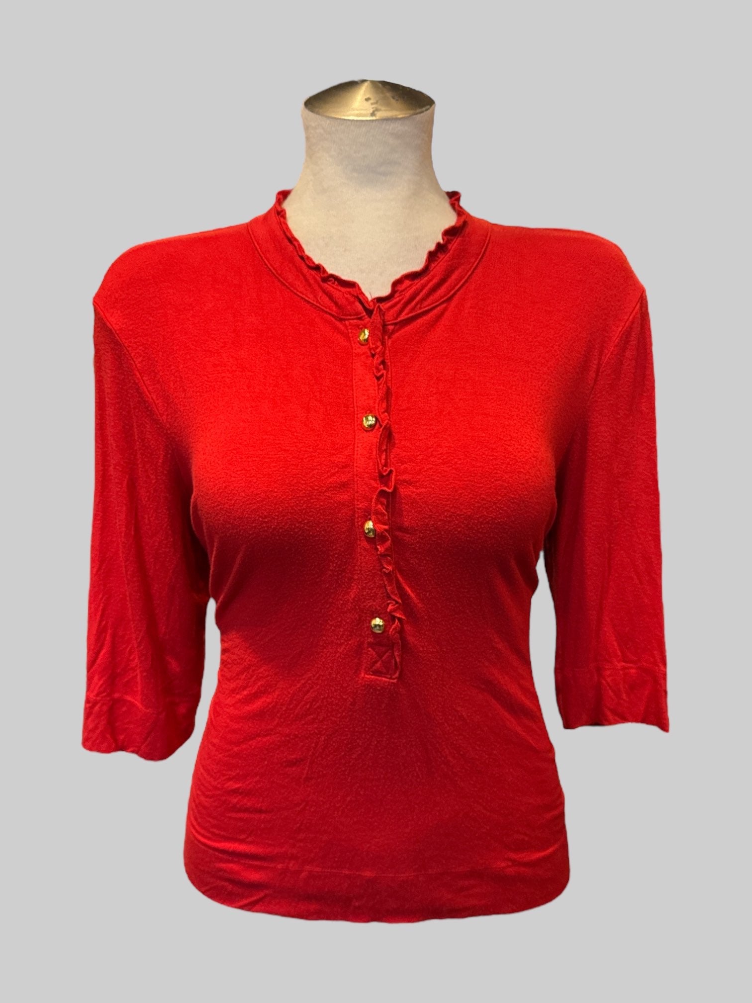 XL Red top with four buttons on front and ruffle neckline