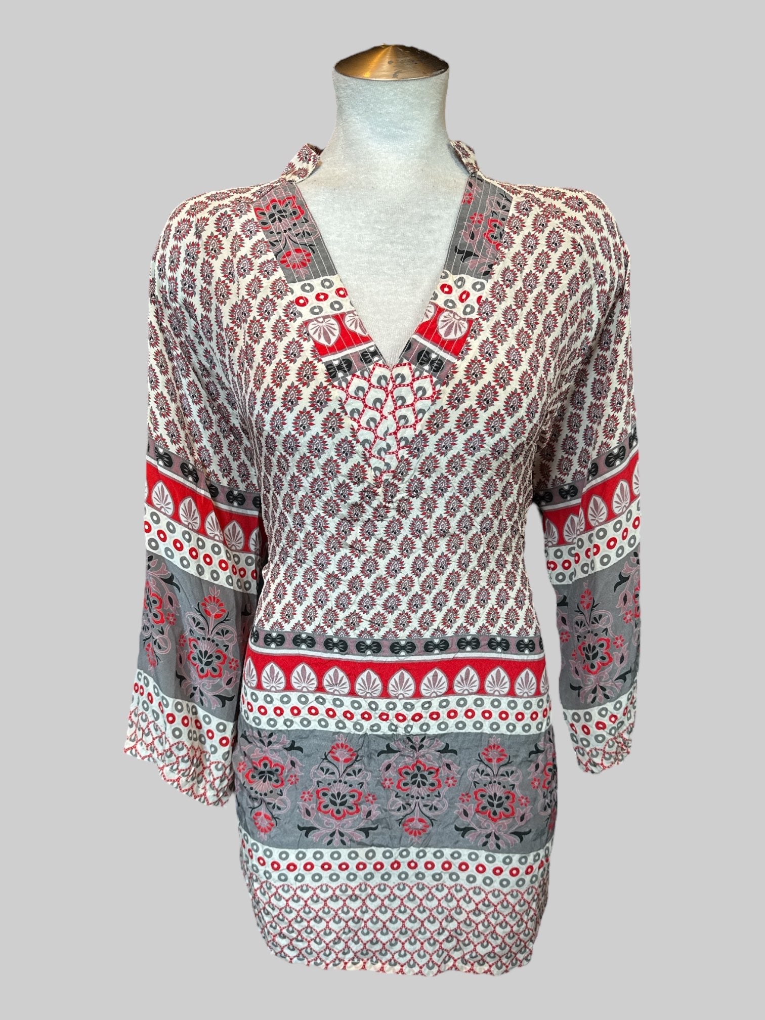 0X White, grey, black, and red top with multiple designs and v-neck